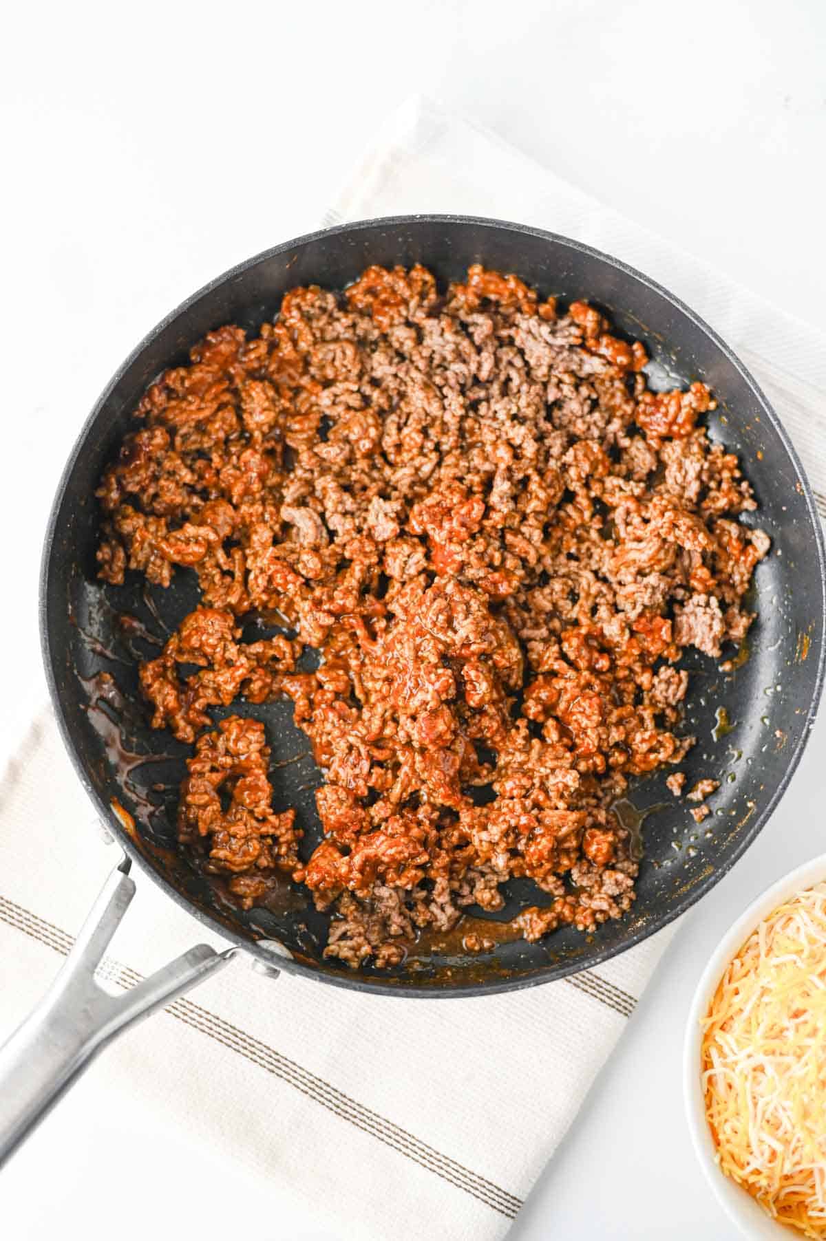 seasoned ground beef mixture in a skilelt