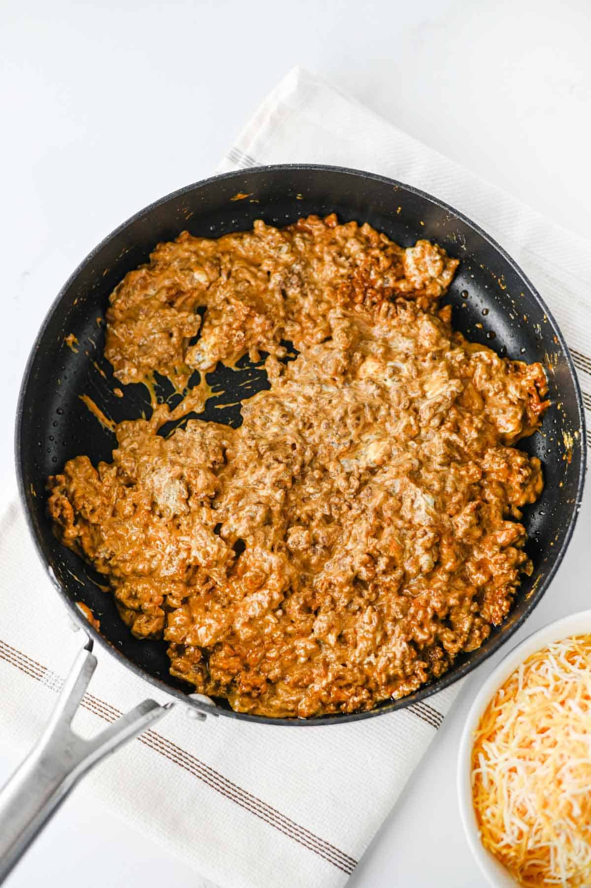 cheesy ground beef mixture in a skillet