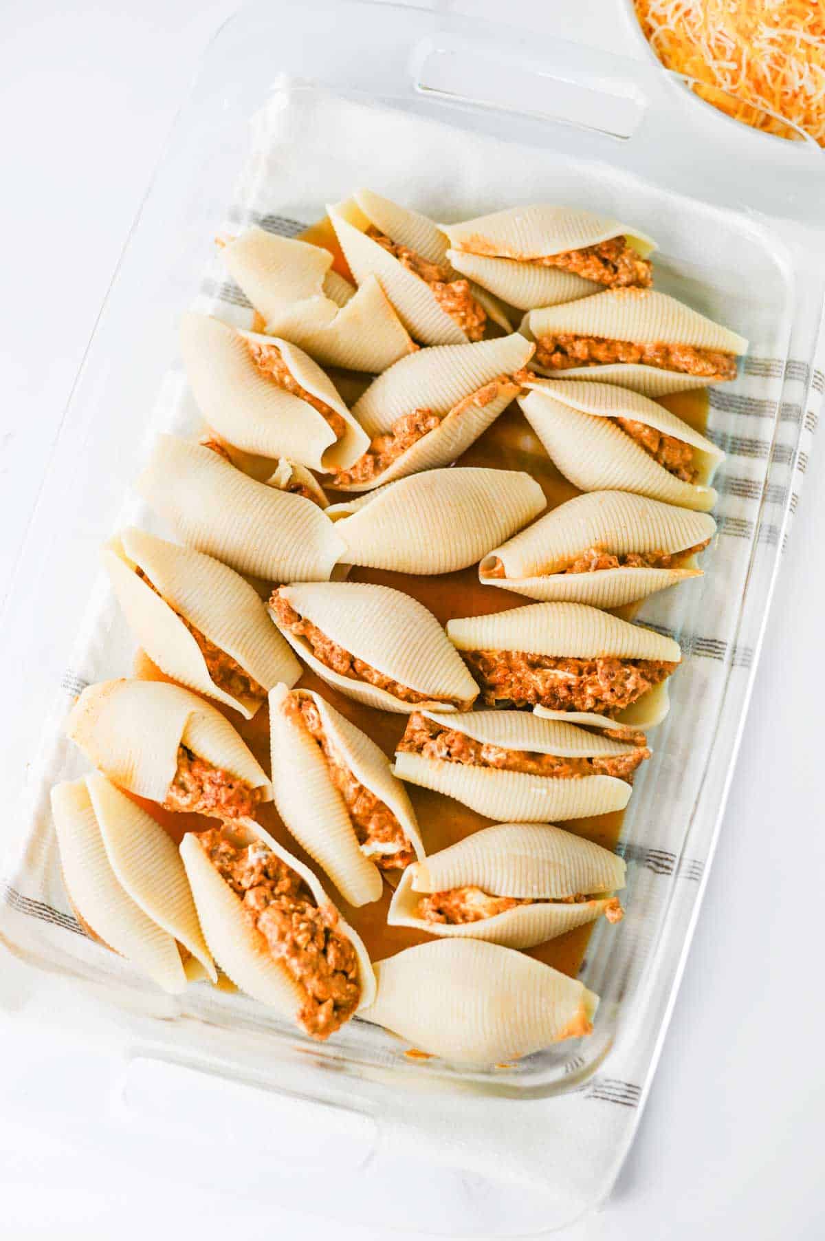 stuffed pasta shells in a baking dish