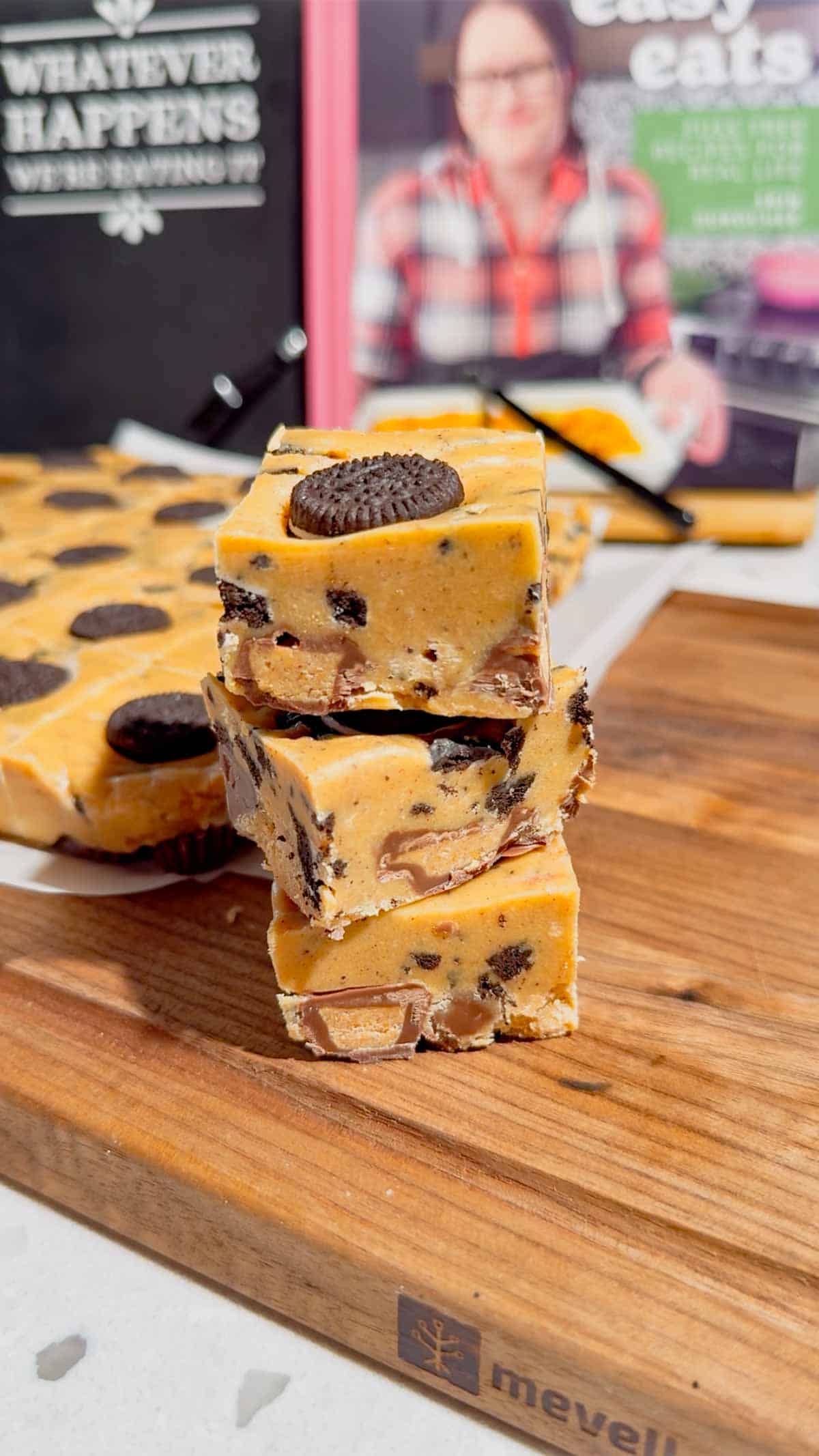 This Oreo Peanut Butter Fudge is the ultimate easy no bake dessert for peanut butter and chocolate lovers! Loaded with mini Reese’s Peanut Butter Cups, creamy peanut butter, peanut butter baking chips, vanilla frosting, and crunchy mini Oreos, this rich homemade fudge is packed with irresistible flavor. If you’re looking for Easy Fudge Recipes, Oreo Desserts, Peanut Butter Desserts, Reese’s Desserts, or No Bake Dessert Recipes, this simple treat is a must-try. Perfect for Christmas Candy, Holiday Desserts, Cookie Exchange Recipes, Party Desserts, Potluck Desserts, and homemade edible gifts, this Microwave Fudge Recipe takes just 15 minutes of prep. Save this Oreo Fudge Recipe when you need an easy dessert that combines cookies and cream with creamy peanut butter and Reese’s candy in every bite!