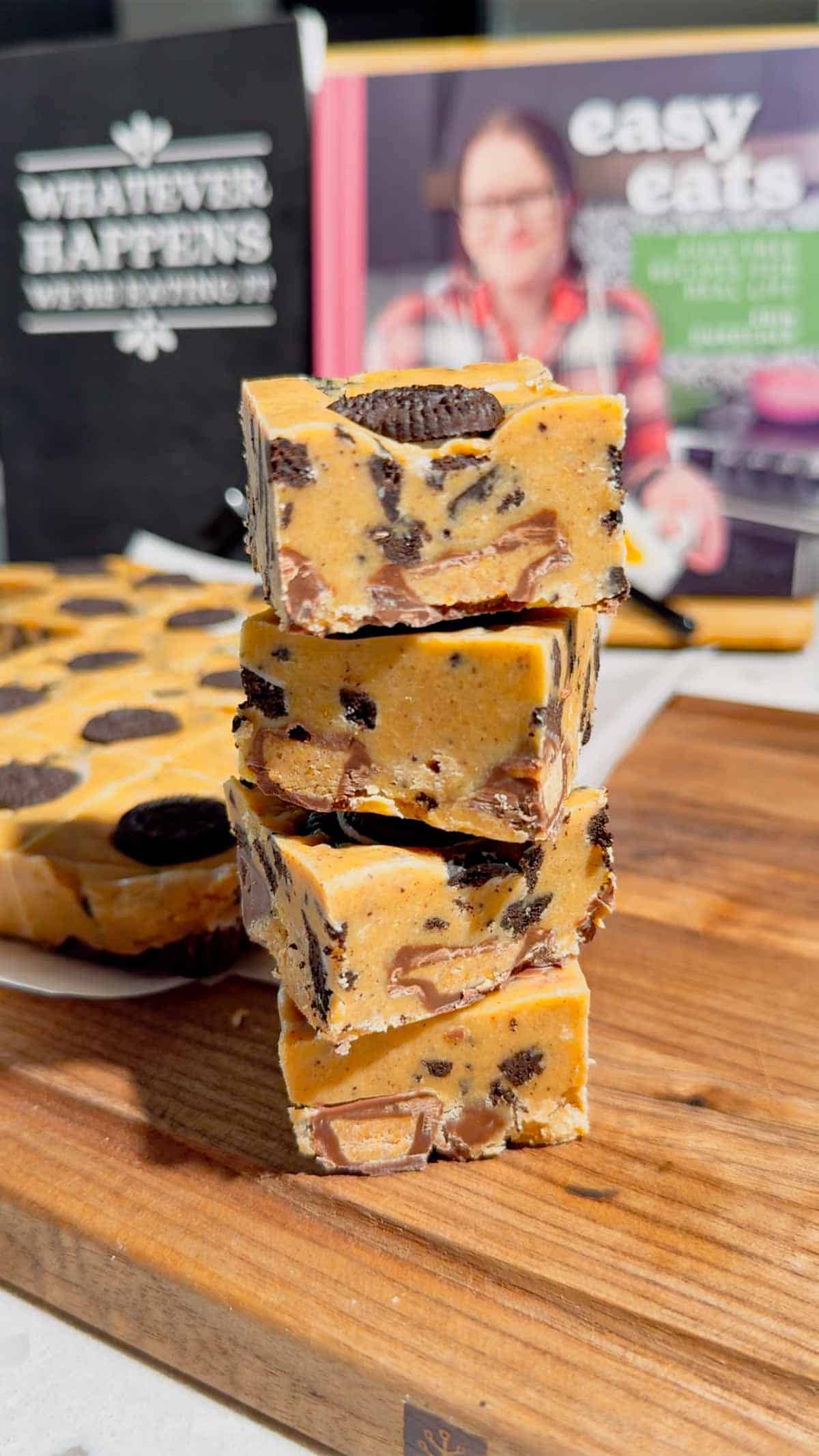 This Oreo Peanut Butter Fudge is the ultimate easy no bake dessert for peanut butter and chocolate lovers! Loaded with mini Reese’s Peanut Butter Cups, creamy peanut butter, peanut butter baking chips, vanilla frosting, and crunchy mini Oreos, this rich homemade fudge is packed with irresistible flavor. If you’re looking for Easy Fudge Recipes, Oreo Desserts, Peanut Butter Desserts, Reese’s Desserts, or No Bake Dessert Recipes, this simple treat is a must-try. Perfect for Christmas Candy, Holiday Desserts, Cookie Exchange Recipes, Party Desserts, Potluck Desserts, and homemade edible gifts, this Microwave Fudge Recipe takes just 15 minutes of prep. Save this Oreo Fudge Recipe when you need an easy dessert that combines cookies and cream with creamy peanut butter and Reese’s candy in every bite!