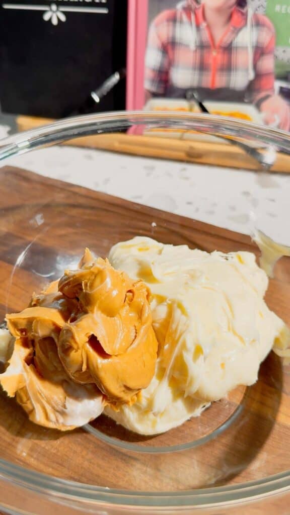peanut butter and vanilla frosting in a mixing bowl