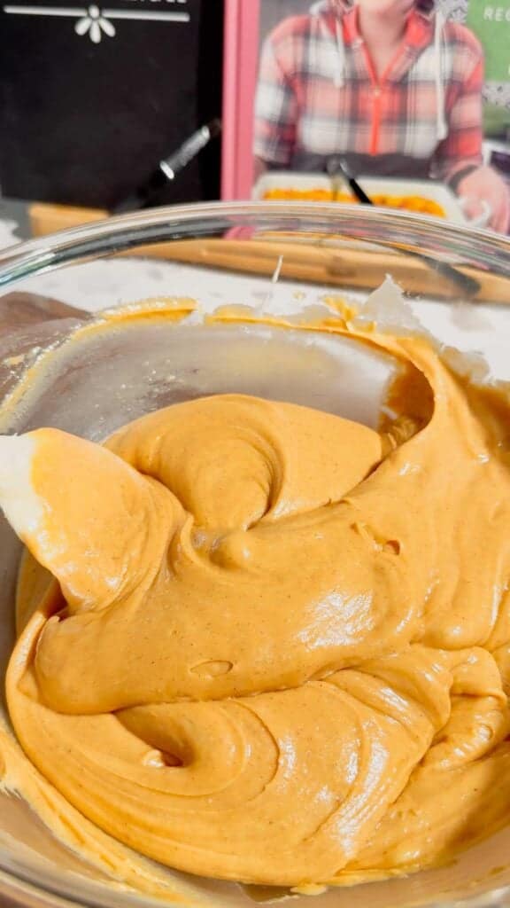 creamy peanut butter mixture in a glass mixing bowl