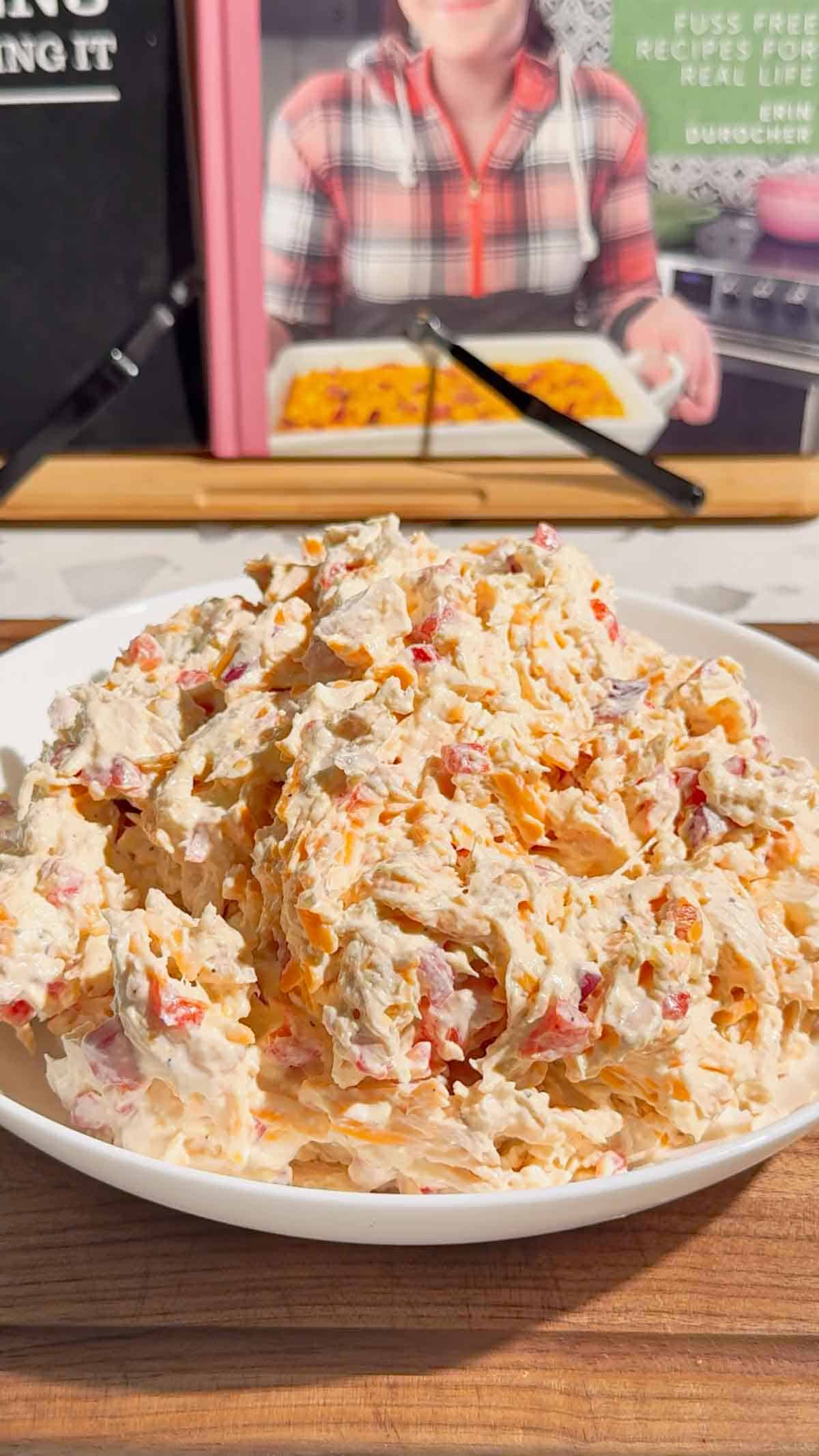 This Pimento Cheese Chicken Salad is a creamy, cheesy twist on classic chicken salad that's perfect for quick lunches, easy dinners, meal prep, parties and potlucks. Made with shredded chicken, cream cheese, mayonnaise, cheddar cheese, diced pimentos, red onion and simple seasonings, this easy chicken salad recipe comes together in just 15 minutes with no cooking required. If you love Southern pimento cheese, this Pimento Cheese Chicken Salad Recipe delivers all that rich, tangy flavor in a hearty chicken salad. Serve it on croissants, sandwich bread, crackers, lettuce wraps or tortillas for an easy lunch idea. This creamy chicken salad with cream cheese is perfect for leftover chicken or rotisserie chicken. Save this easy Pimento Cheese Chicken Salad for busy weekdays and summer lunches!