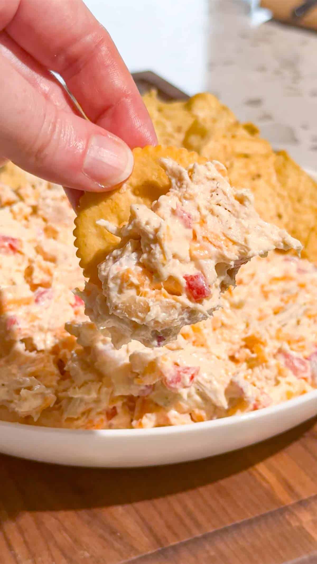 This Pimento Cheese Chicken Salad is a creamy, cheesy twist on classic chicken salad that's perfect for quick lunches, easy dinners, meal prep, parties and potlucks. Made with shredded chicken, cream cheese, mayonnaise, cheddar cheese, diced pimentos, red onion and simple seasonings, this easy chicken salad recipe comes together in just 15 minutes with no cooking required. If you love Southern pimento cheese, this Pimento Cheese Chicken Salad Recipe delivers all that rich, tangy flavor in a hearty chicken salad. Serve it on croissants, sandwich bread, crackers, lettuce wraps or tortillas for an easy lunch idea. This creamy chicken salad with cream cheese is perfect for leftover chicken or rotisserie chicken. Save this easy Pimento Cheese Chicken Salad for busy weekdays and summer lunches!