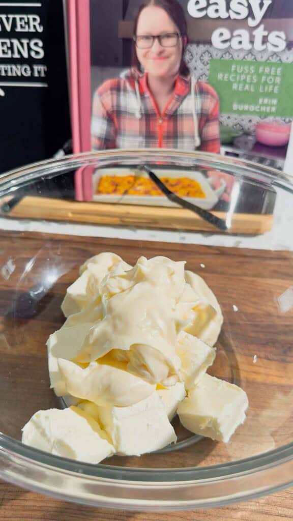 mayo and cream cheese in a glass mixing bowl