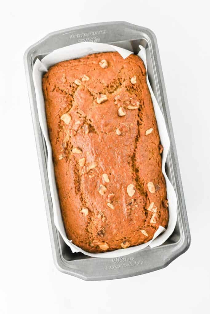 baked pumpkin banana bread in a loaf pan
