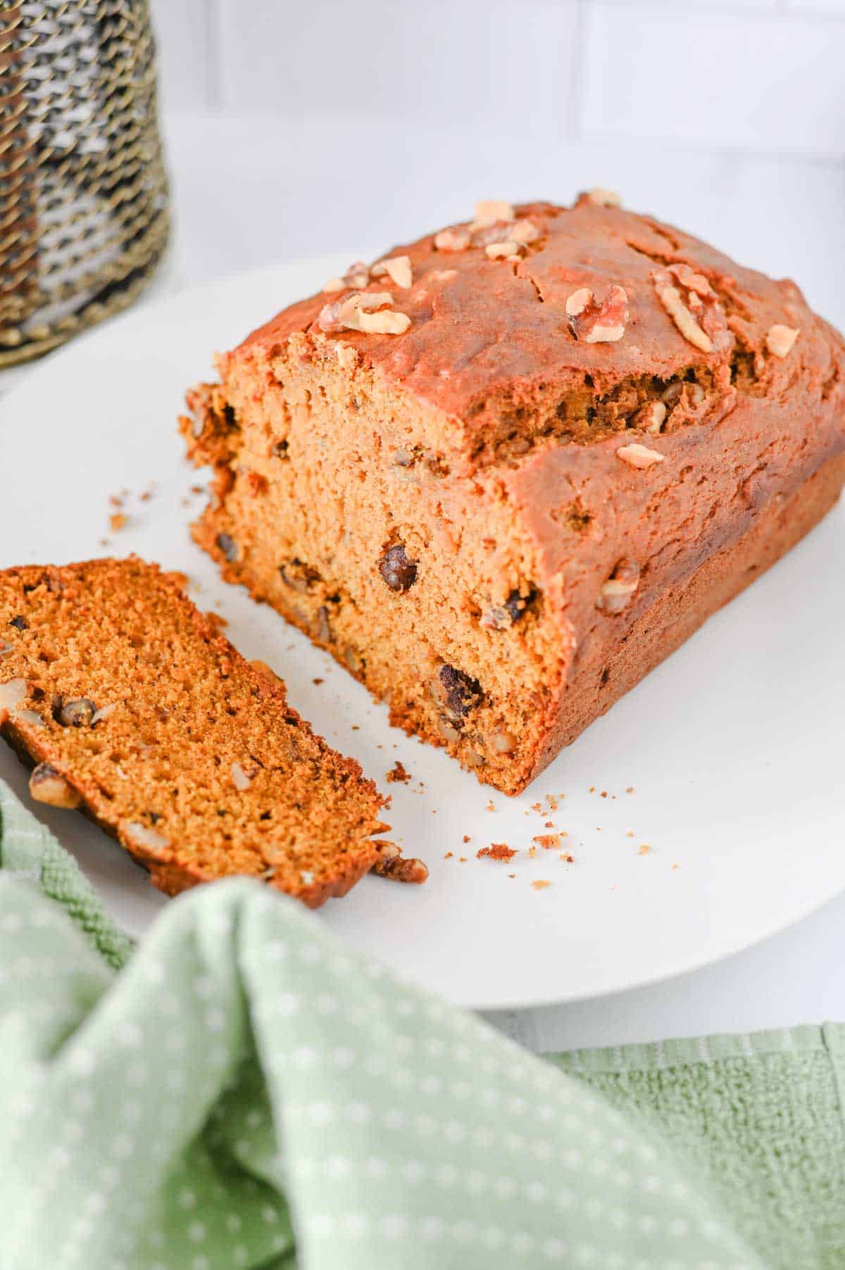 This Pumpkin Banana Bread is the ultimate cozy fall baking recipe, combining moist banana bread with pumpkin puree and warm pumpkin pie spice in one easy homemade loaf. If you love Pumpkin Bread Recipes, Banana Bread Recipes, Pumpkin Banana Bread Recipes, and Easy Fall Baking Recipes, this simple quick bread is a must-try. Ripe bananas and pumpkin puree keep every slice incredibly soft and moist, while brown sugar adds rich sweetness and chopped walnuts bring a delicious crunch. Serve this Easy Pumpkin Banana Bread for breakfast, brunch, dessert, or an afternoon snack with coffee. It's a delicious way to use Overripe Bananas and Canned Pumpkin and belongs on every list of Fall Bread Recipes, Pumpkin Recipes, Fall Desserts, Autumn Baking Ideas, and Cozy Fall Recipes.