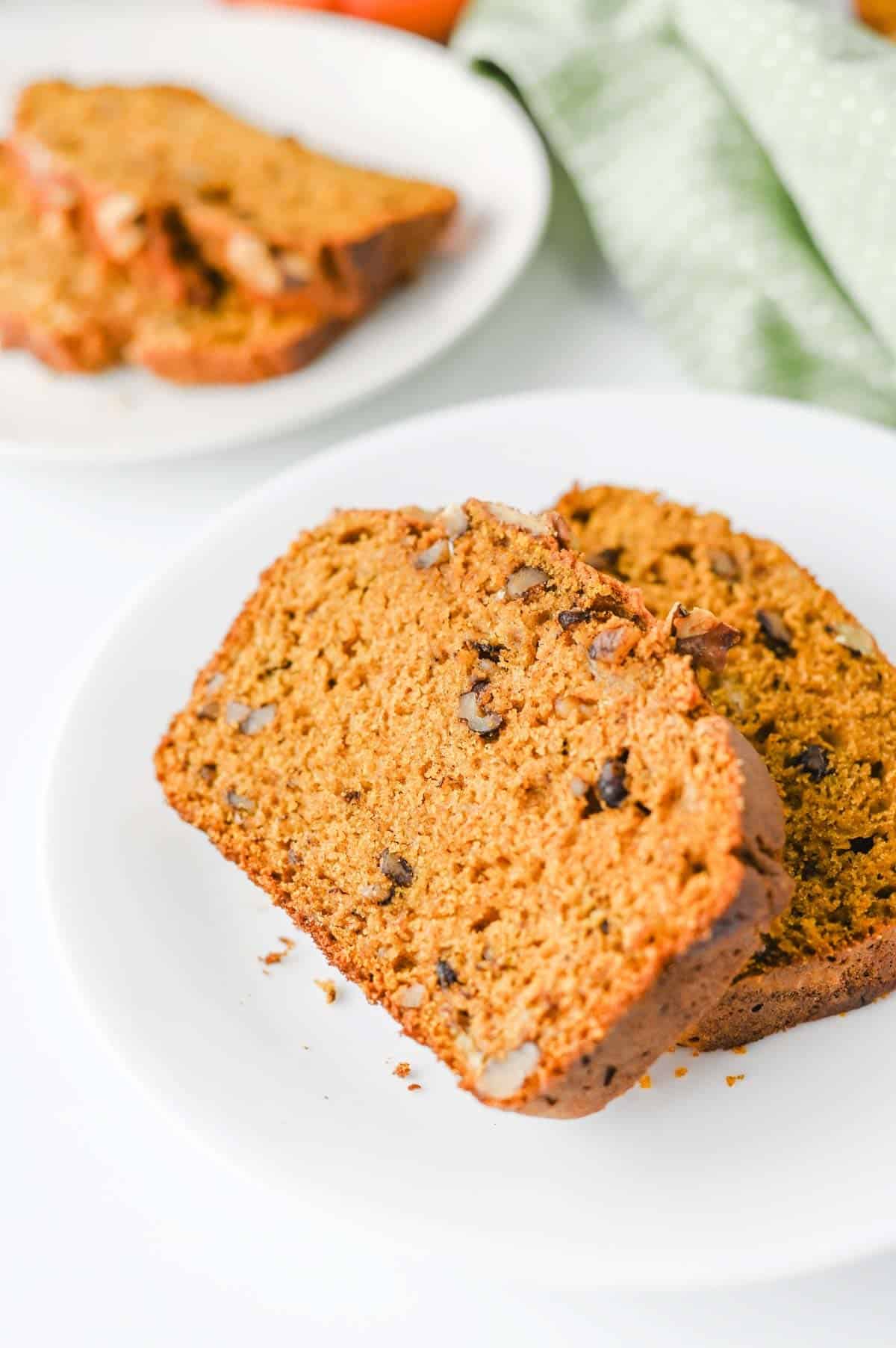 This Pumpkin Banana Bread is the ultimate cozy fall baking recipe, combining moist banana bread with pumpkin puree and warm pumpkin pie spice in one easy homemade loaf. If you love Pumpkin Bread Recipes, Banana Bread Recipes, Pumpkin Banana Bread Recipes, and Easy Fall Baking Recipes, this simple quick bread is a must-try. Ripe bananas and pumpkin puree keep every slice incredibly soft and moist, while brown sugar adds rich sweetness and chopped walnuts bring a delicious crunch. Serve this Easy Pumpkin Banana Bread for breakfast, brunch, dessert, or an afternoon snack with coffee. It's a delicious way to use Overripe Bananas and Canned Pumpkin and belongs on every list of Fall Bread Recipes, Pumpkin Recipes, Fall Desserts, Autumn Baking Ideas, and Cozy Fall Recipes.