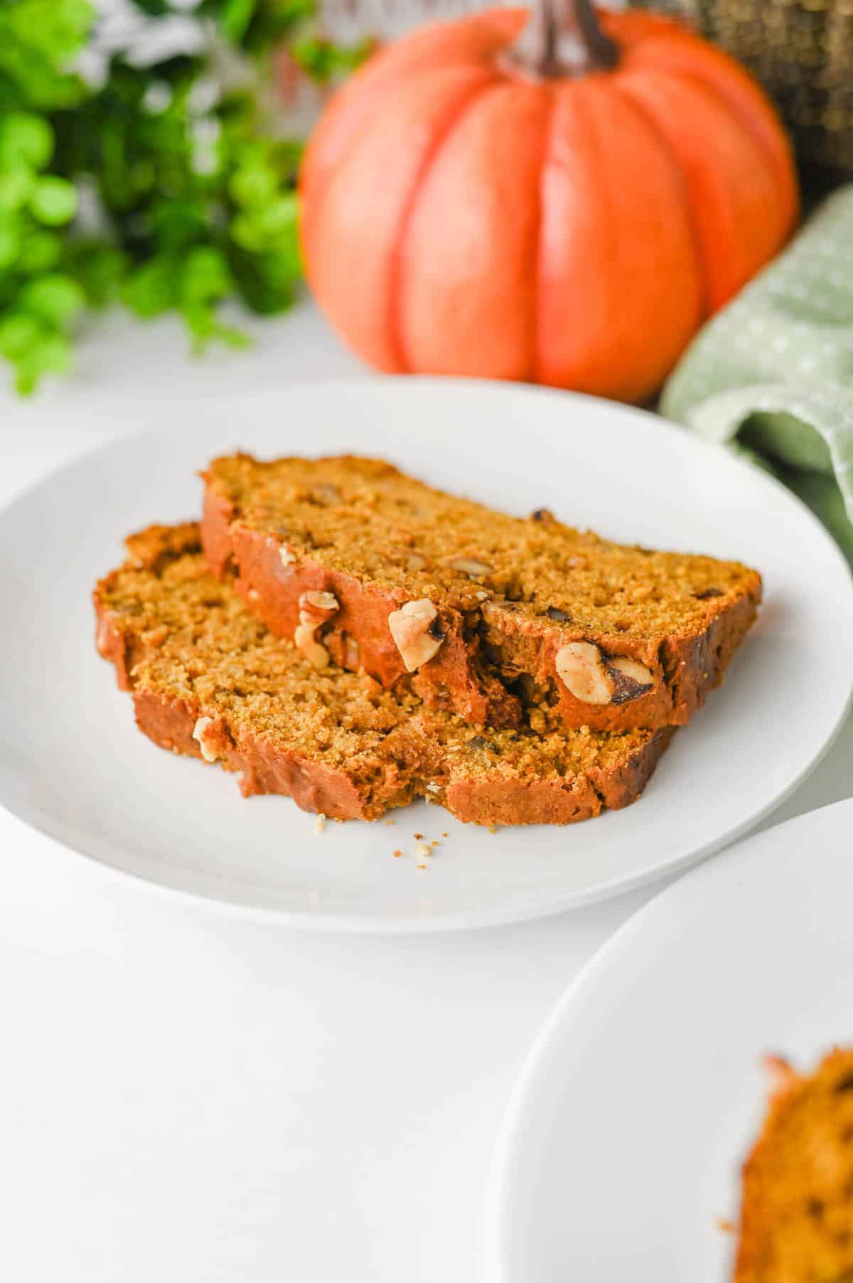 This Pumpkin Banana Bread is the ultimate cozy fall baking recipe, combining moist banana bread with pumpkin puree and warm pumpkin pie spice in one easy homemade loaf. If you love Pumpkin Bread Recipes, Banana Bread Recipes, Pumpkin Banana Bread Recipes, and Easy Fall Baking Recipes, this simple quick bread is a must-try. Ripe bananas and pumpkin puree keep every slice incredibly soft and moist, while brown sugar adds rich sweetness and chopped walnuts bring a delicious crunch. Serve this Easy Pumpkin Banana Bread for breakfast, brunch, dessert, or an afternoon snack with coffee. It's a delicious way to use Overripe Bananas and Canned Pumpkin and belongs on every list of Fall Bread Recipes, Pumpkin Recipes, Fall Desserts, Autumn Baking Ideas, and Cozy Fall Recipes.
