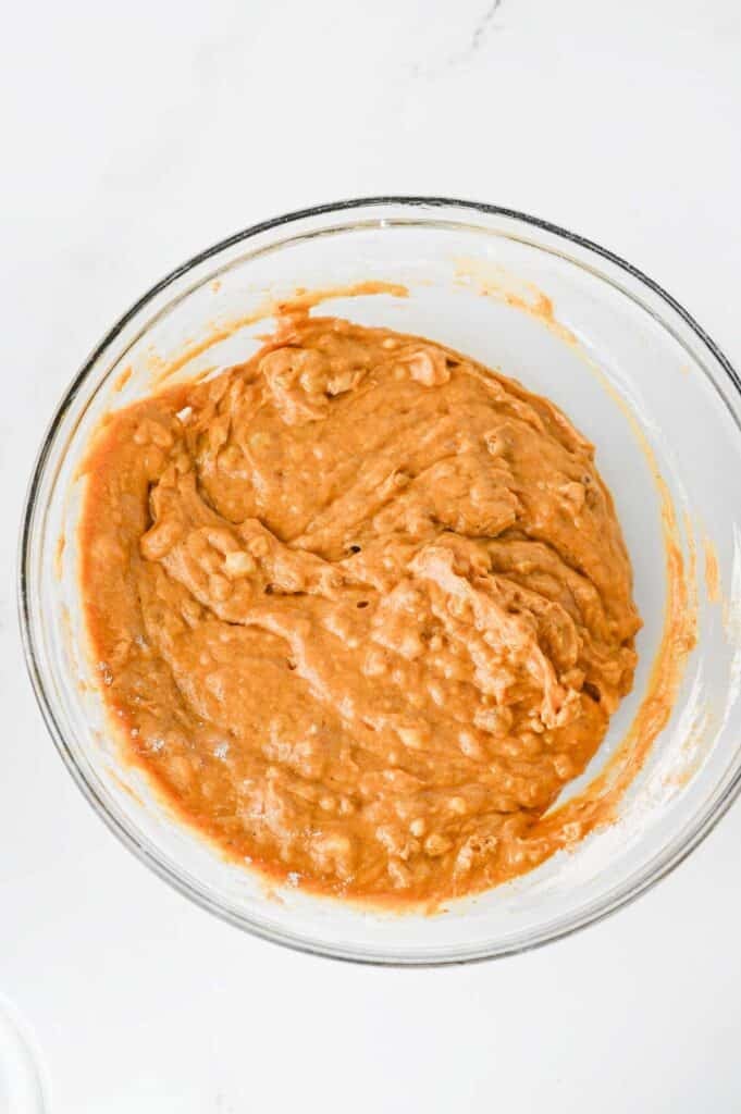 chopped walnuts stirred into pumpkin banana bread batter