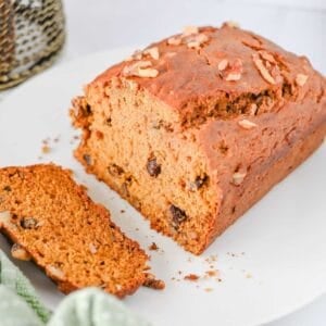 This Pumpkin Banana Bread is the ultimate cozy fall baking recipe, combining moist banana bread with pumpkin puree and warm pumpkin pie spice in one easy homemade loaf. If you love Pumpkin Bread Recipes, Banana Bread Recipes, Pumpkin Banana Bread Recipes, and Easy Fall Baking Recipes, this simple quick bread is a must-try. Ripe bananas and pumpkin puree keep every slice incredibly soft and moist, while brown sugar adds rich sweetness and chopped walnuts bring a delicious crunch. Serve this Easy Pumpkin Banana Bread for breakfast, brunch, dessert, or an afternoon snack with coffee. It's a delicious way to use Overripe Bananas and Canned Pumpkin and belongs on every list of Fall Bread Recipes, Pumpkin Recipes, Fall Desserts, Autumn Baking Ideas, and Cozy Fall Recipes.