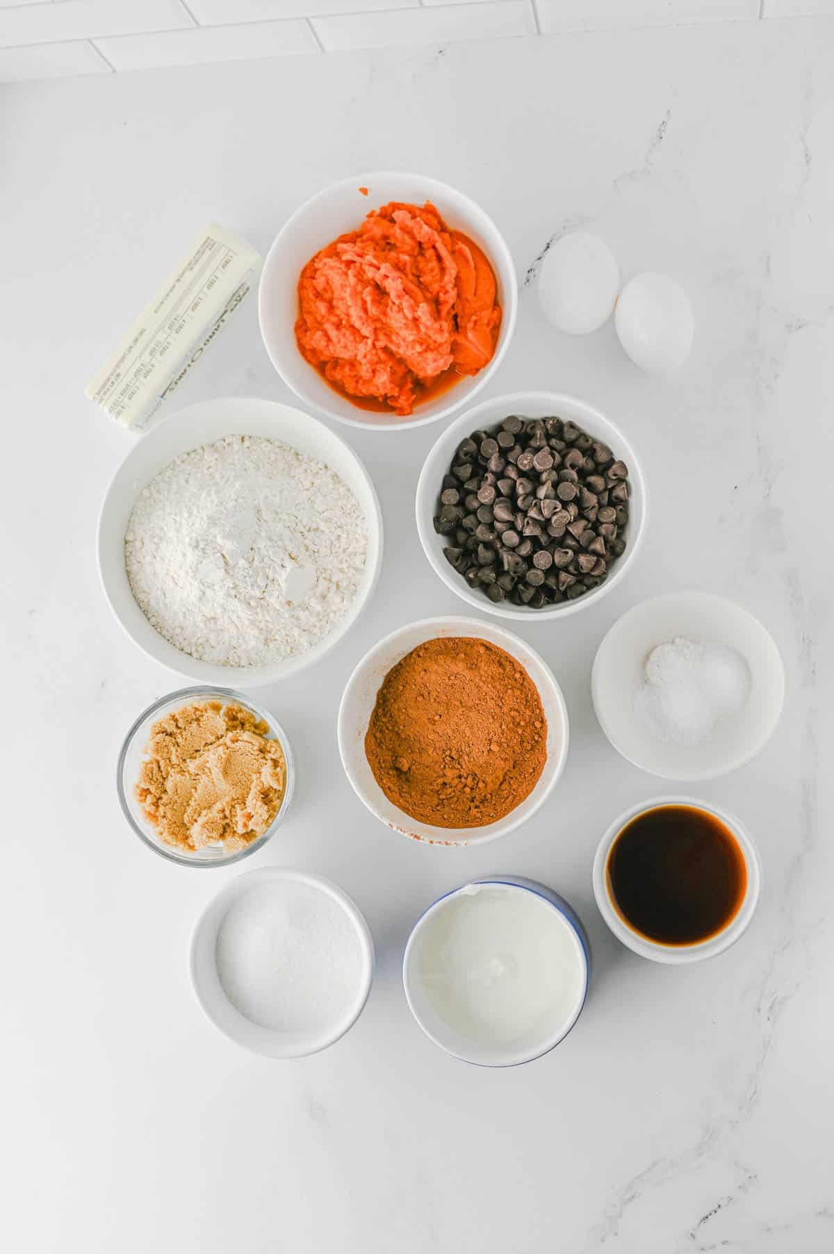 pumpkin chocolate muffin ingredients on the kitchen counter