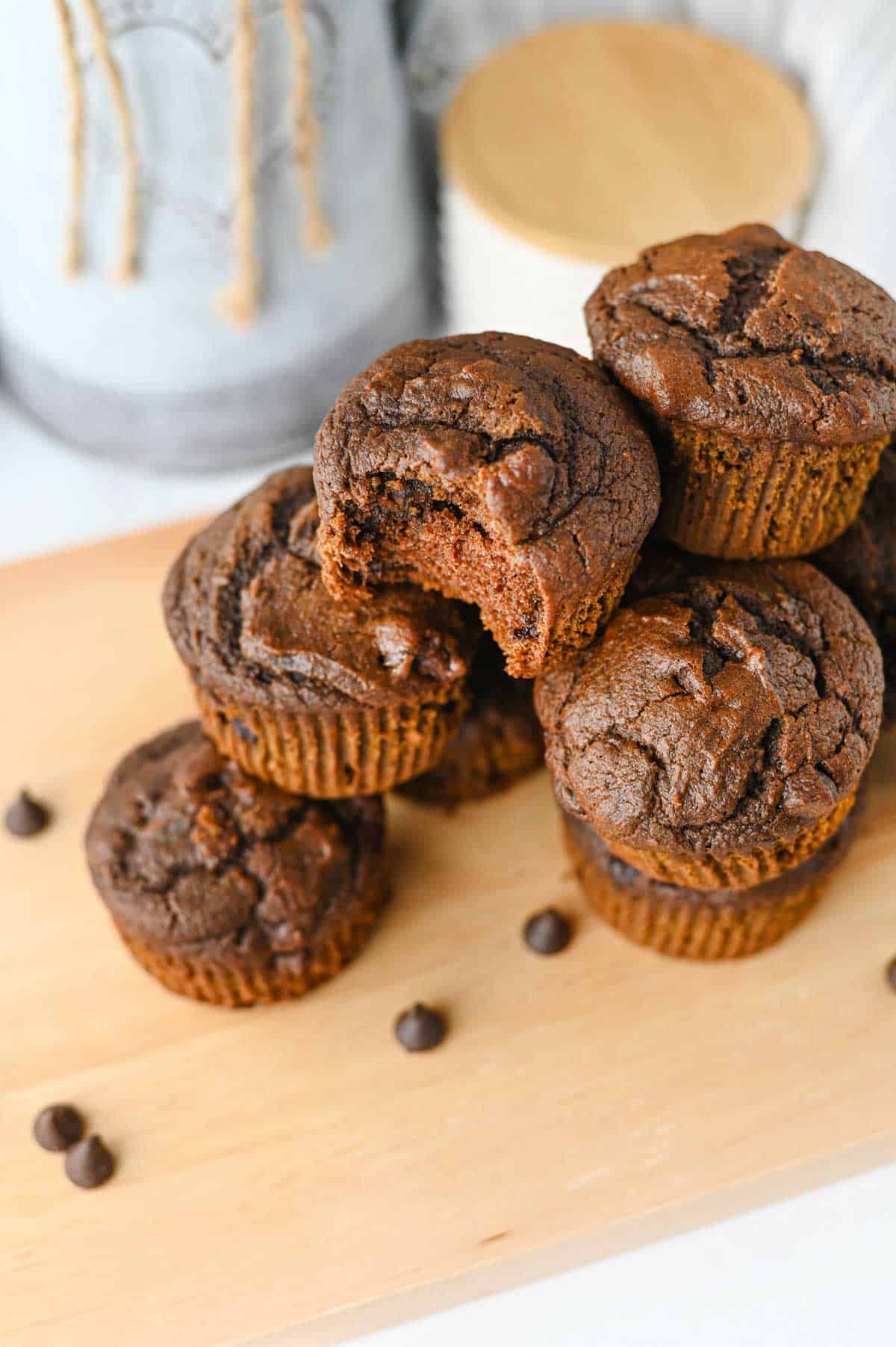 These Pumpkin Chocolate Muffins are the ultimate cozy treat for fall baking! Made with pumpkin puree, cocoa powder, sour cream, and plenty of semi sweet chocolate chips, these moist Pumpkin Chocolate Chip Muffins are rich, fluffy, and loaded with chocolate in every bite. If you love Easy Pumpkin Recipes, Chocolate Pumpkin Muffins, Pumpkin Recipes Dessert ideas, and homemade Fall Muffins, this recipe belongs on your baking list. They're perfect for breakfast, dessert, lunchboxes, after-school snacks, or Thanksgiving morning. Add these easy Pumpkin Muffins to your favorite Fall Baking Recipes, Pumpkin Chocolate Recipes, Fall Dessert Ideas, and Pumpkin Baking Ideas. These moist Chocolate Chip Pumpkin Muffins are simple to make and ready in under 40 minutes for an easy autumn treat the whole family will love!