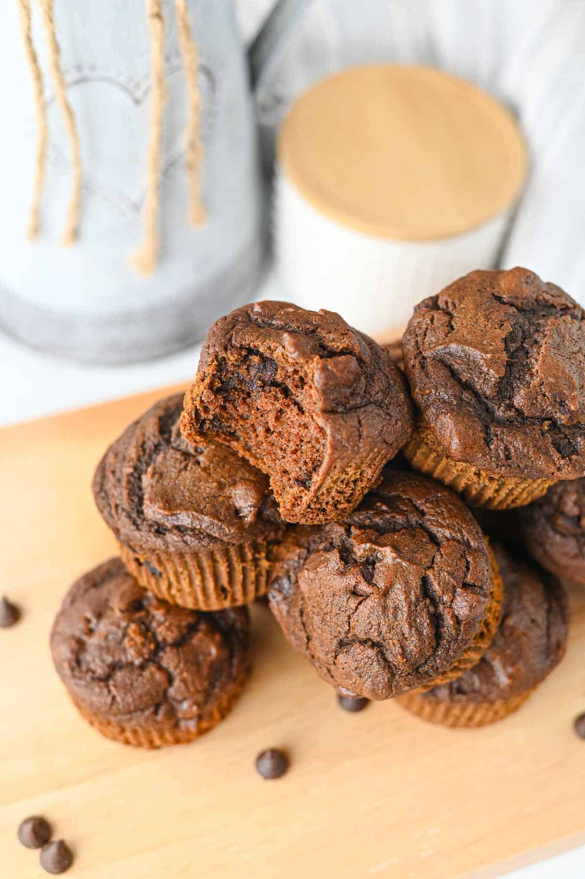 These Pumpkin Chocolate Muffins are the ultimate cozy treat for fall baking! Made with pumpkin puree, cocoa powder, sour cream, and plenty of semi sweet chocolate chips, these moist Pumpkin Chocolate Chip Muffins are rich, fluffy, and loaded with chocolate in every bite. If you love Easy Pumpkin Recipes, Chocolate Pumpkin Muffins, Pumpkin Recipes Dessert ideas, and homemade Fall Muffins, this recipe belongs on your baking list. They're perfect for breakfast, dessert, lunchboxes, after-school snacks, or Thanksgiving morning. Add these easy Pumpkin Muffins to your favorite Fall Baking Recipes, Pumpkin Chocolate Recipes, Fall Dessert Ideas, and Pumpkin Baking Ideas. These moist Chocolate Chip Pumpkin Muffins are simple to make and ready in under 40 minutes for an easy autumn treat the whole family will love!