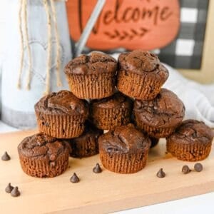 These Pumpkin Chocolate Muffins are the ultimate cozy treat for fall baking! Made with pumpkin puree, cocoa powder, sour cream, and plenty of semi sweet chocolate chips, these moist Pumpkin Chocolate Chip Muffins are rich, fluffy, and loaded with chocolate in every bite. If you love Easy Pumpkin Recipes, Chocolate Pumpkin Muffins, Pumpkin Recipes Dessert ideas, and homemade Fall Muffins, this recipe belongs on your baking list. They're perfect for breakfast, dessert, lunchboxes, after-school snacks, or Thanksgiving morning. Add these easy Pumpkin Muffins to your favorite Fall Baking Recipes, Pumpkin Chocolate Recipes, Fall Dessert Ideas, and Pumpkin Baking Ideas. These moist Chocolate Chip Pumpkin Muffins are simple to make and ready in under 40 minutes for an easy autumn treat the whole family will love!
