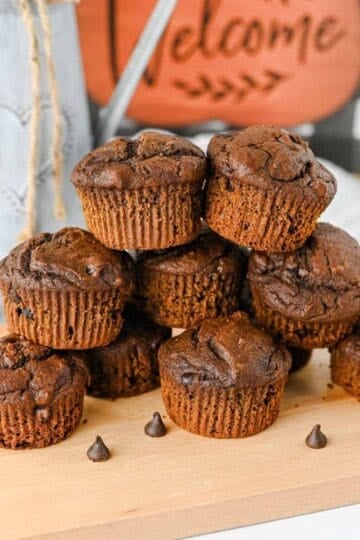 These Pumpkin Chocolate Muffins are the ultimate cozy treat for fall baking! Made with pumpkin puree, cocoa powder, sour cream, and plenty of semi sweet chocolate chips, these moist Pumpkin Chocolate Chip Muffins are rich, fluffy, and loaded with chocolate in every bite. If you love Easy Pumpkin Recipes, Chocolate Pumpkin Muffins, Pumpkin Recipes Dessert ideas, and homemade Fall Muffins, this recipe belongs on your baking list. They're perfect for breakfast, dessert, lunchboxes, after-school snacks, or Thanksgiving morning. Add these easy Pumpkin Muffins to your favorite Fall Baking Recipes, Pumpkin Chocolate Recipes, Fall Dessert Ideas, and Pumpkin Baking Ideas. These moist Chocolate Chip Pumpkin Muffins are simple to make and ready in under 40 minutes for an easy autumn treat the whole family will love!