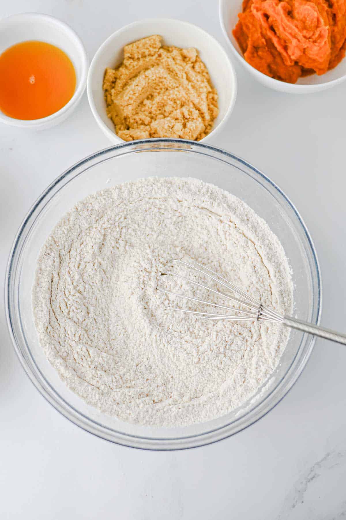 dry ingredients whisked together in a glass mixing bowl