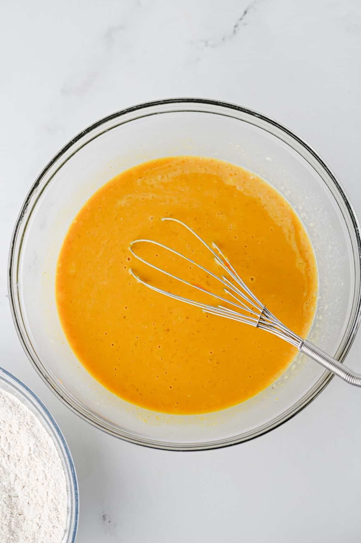 pumpkin pancake batter wet ingredients in a mixing bowl