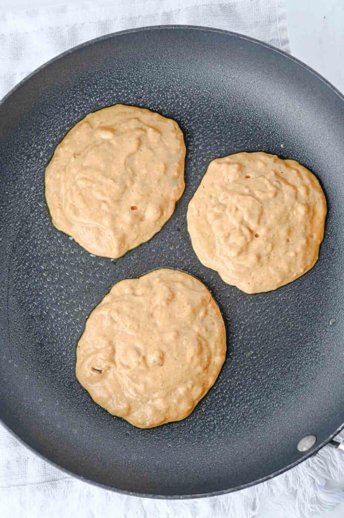 pumpkin pancake batter in a skillet