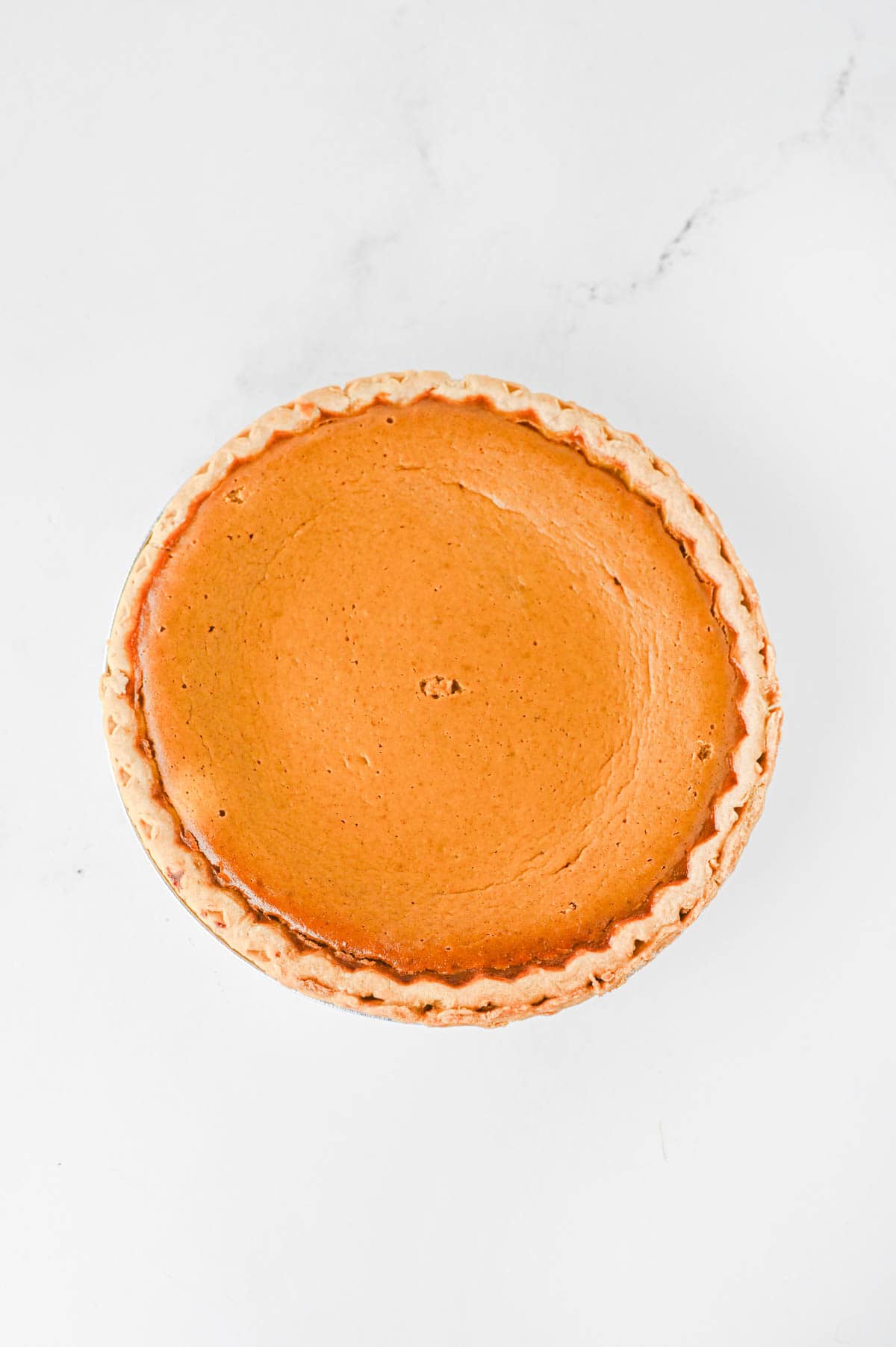 Pumpkin Pie Cheesecake is the perfect fall dessert when you can’t decide between classic pumpkin pie and creamy cheesecake! This easy Pumpkin Pie Cheesecake Recipe starts with a premade flaky pie crust and layers a sweet vanilla cream cheese filling with a rich pumpkin pie filling made with pumpkin puree, brown sugar, pumpkin pie spice, eggs, and heavy cream. It’s a delicious Thanksgiving dessert, holiday pie recipe, and fall baking idea for family dinners, potlucks, Friendsgiving, or Christmas. If you love easy pumpkin desserts, pumpkin cheesecake recipes, homemade pumpkin pie, and creamy cheesecake, this layered dessert is a must-try. Save this easy pumpkin cheesecake pie for your fall dessert recipes, Thanksgiving pie ideas, holiday baking, and pumpkin recipes to make all season long!