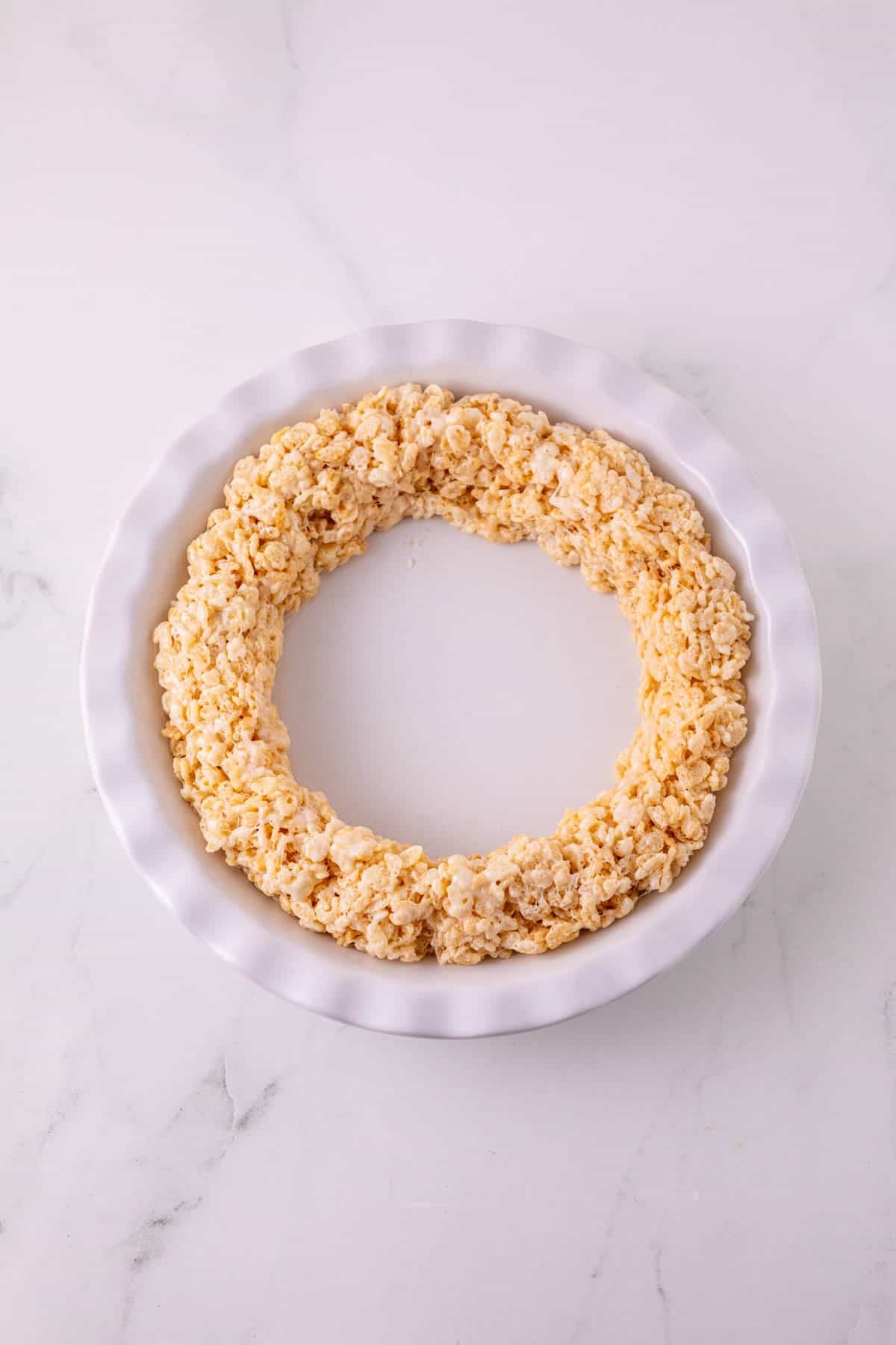 ring of rice krispie treat mixture in a pie plate