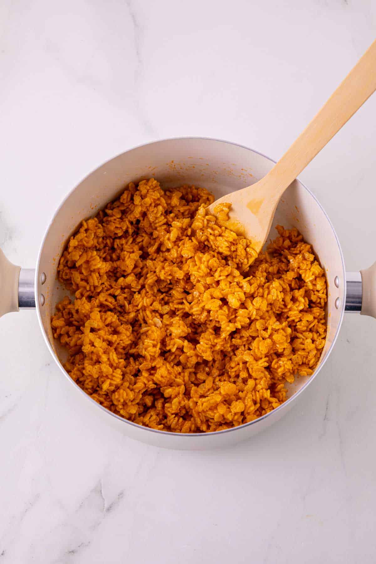 pumpkin rice krispie mixture in a saucepan