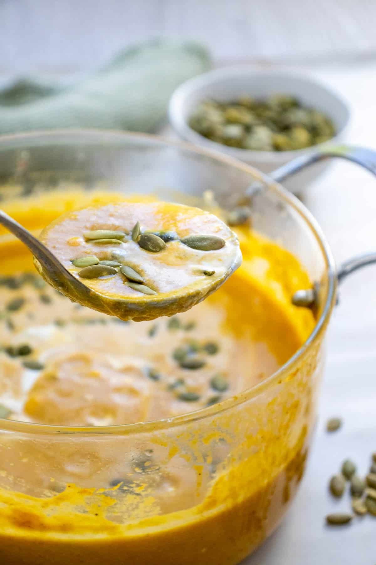 This Creamy Pumpkin Soup is the ultimate cozy fall comfort food! Made with smooth pumpkin puree, onion, garlic, warm ginger, cumin, nutmeg, flavorful broth, and rich heavy cream, this Easy Pumpkin Soup Recipe is ready in just 40 minutes. If you’re searching for Pumpkin Soup Recipes, Fall Soup Recipes, Creamy Soup Recipes, or easy Pumpkin Recipes for dinner, this simple homemade soup is a must-try. Serve this Creamy Pumpkin Soup with crusty bread, croutons, toasted pumpkin seeds, or a swirl of cream for a comforting meal. It’s perfect for chilly fall nights, Thanksgiving dinner, holiday lunches, or an easy weeknight meal. Save this Pumpkin Soup Recipe for your fall meal planning, and enjoy a warm bowl of creamy, savory pumpkin goodness all season long!
