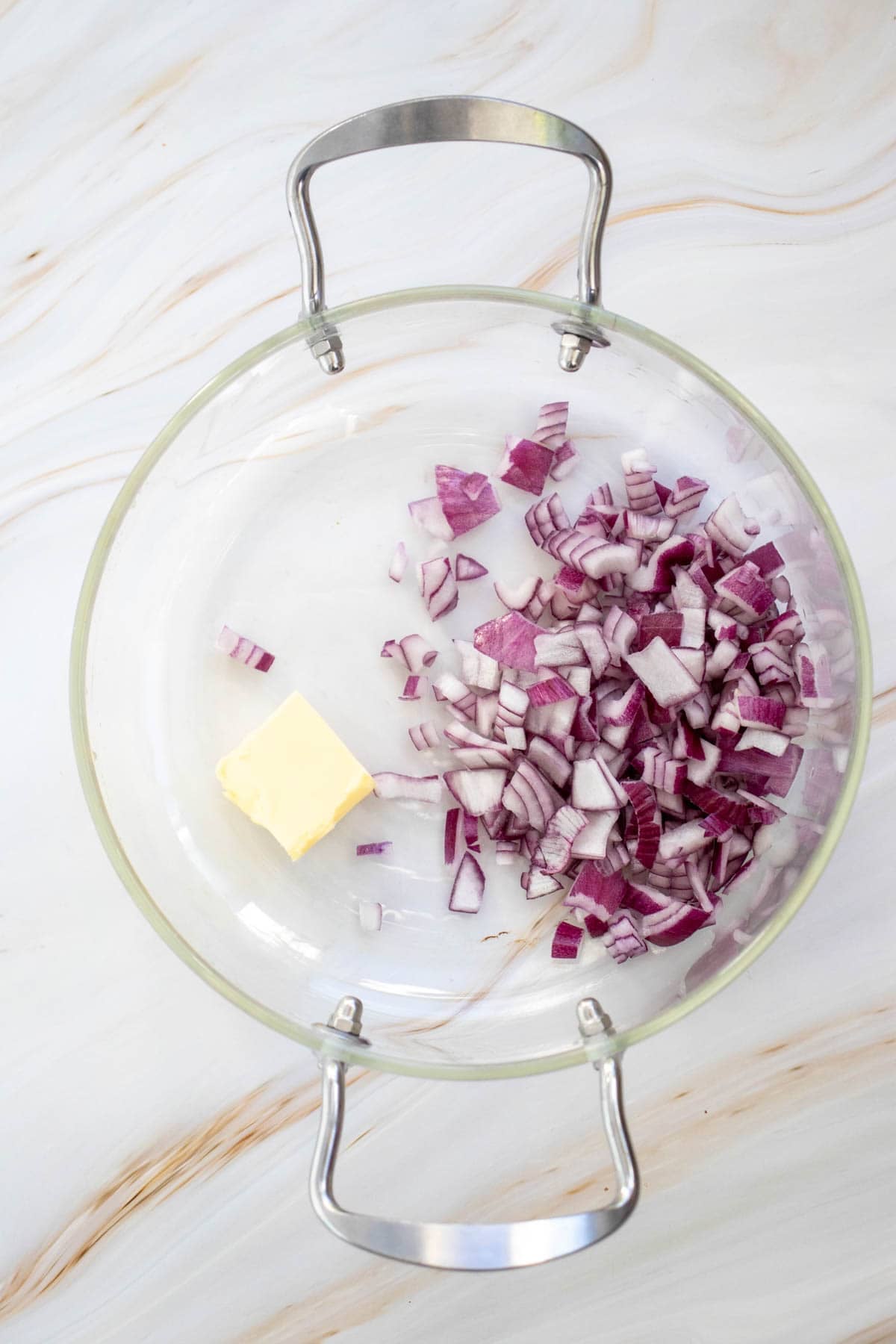 chopped red onion and butter in a soup pot