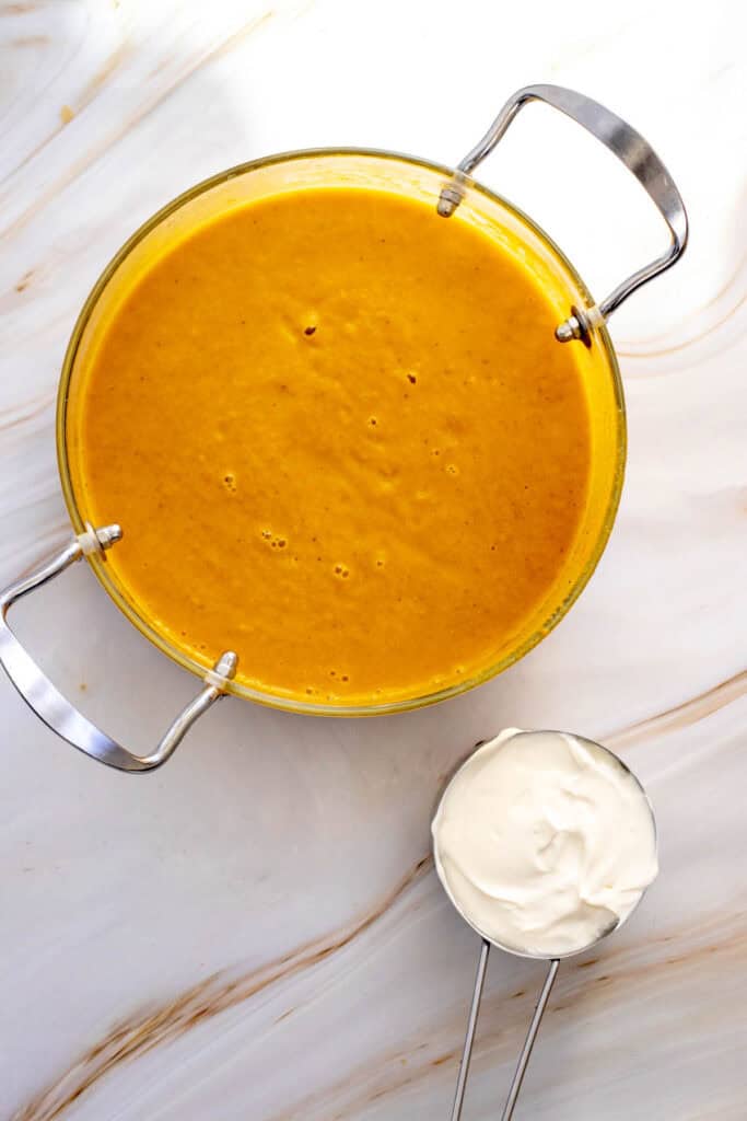 This Creamy Pumpkin Soup is the ultimate cozy fall comfort food! Made with smooth pumpkin puree, onion, garlic, warm ginger, cumin, nutmeg, flavorful broth, and rich heavy cream, this Easy Pumpkin Soup Recipe is ready in just 40 minutes. If you’re searching for Pumpkin Soup Recipes, Fall Soup Recipes, Creamy Soup Recipes, or easy Pumpkin Recipes for dinner, this simple homemade soup is a must-try. Serve this Creamy Pumpkin Soup with crusty bread, croutons, toasted pumpkin seeds, or a swirl of cream for a comforting meal. It’s perfect for chilly fall nights, Thanksgiving dinner, holiday lunches, or an easy weeknight meal. Save this Pumpkin Soup Recipe for your fall meal planning, and enjoy a warm bowl of creamy, savory pumpkin goodness all season long!