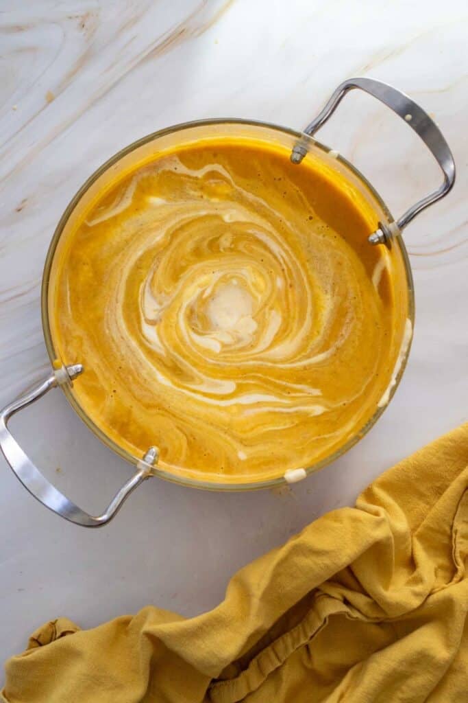 This Creamy Pumpkin Soup is the ultimate cozy fall comfort food! Made with smooth pumpkin puree, onion, garlic, warm ginger, cumin, nutmeg, flavorful broth, and rich heavy cream, this Easy Pumpkin Soup Recipe is ready in just 40 minutes. If you’re searching for Pumpkin Soup Recipes, Fall Soup Recipes, Creamy Soup Recipes, or easy Pumpkin Recipes for dinner, this simple homemade soup is a must-try. Serve this Creamy Pumpkin Soup with crusty bread, croutons, toasted pumpkin seeds, or a swirl of cream for a comforting meal. It’s perfect for chilly fall nights, Thanksgiving dinner, holiday lunches, or an easy weeknight meal. Save this Pumpkin Soup Recipe for your fall meal planning, and enjoy a warm bowl of creamy, savory pumpkin goodness all season long!