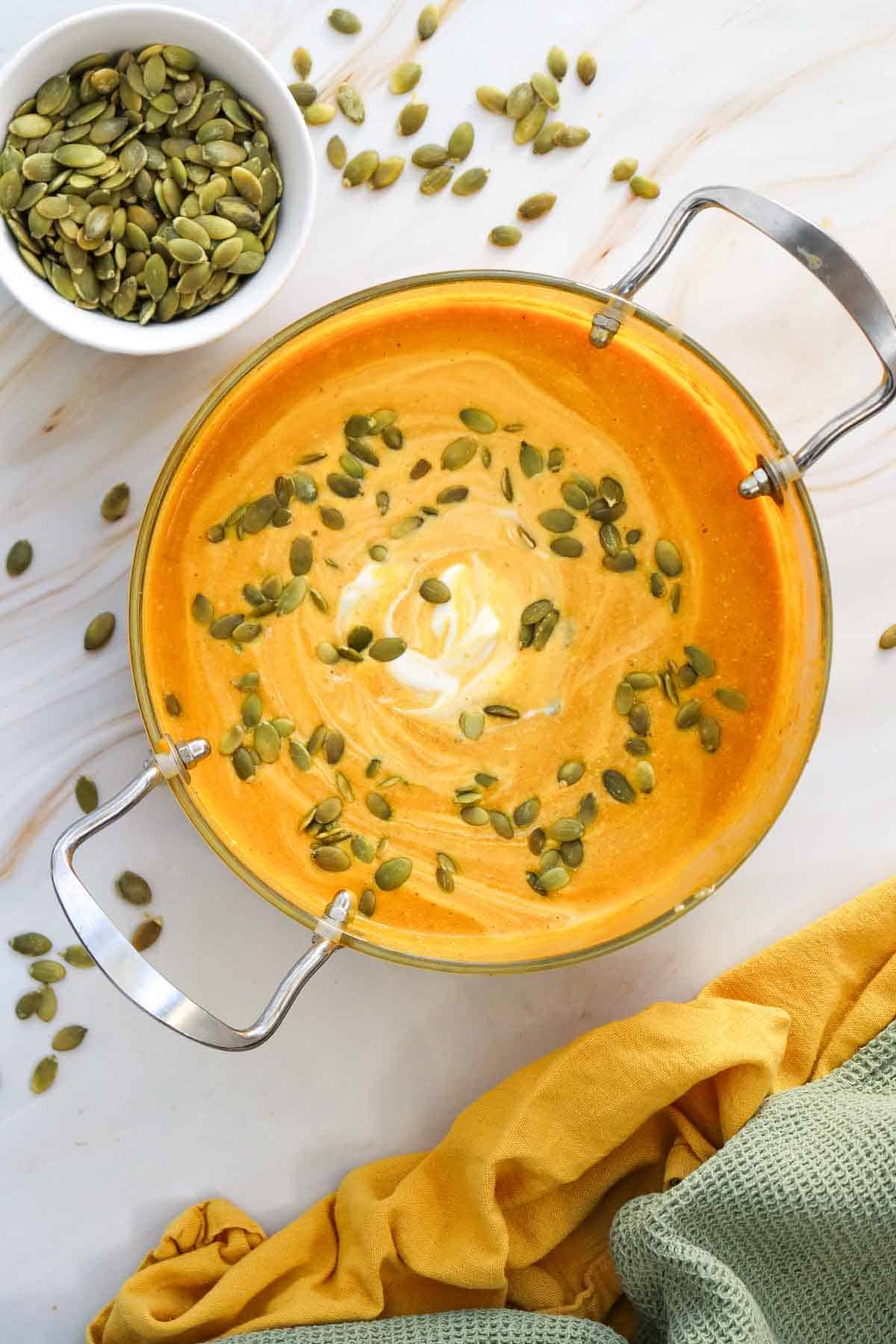 This Creamy Pumpkin Soup is the ultimate cozy fall comfort food! Made with smooth pumpkin puree, onion, garlic, warm ginger, cumin, nutmeg, flavorful broth, and rich heavy cream, this Easy Pumpkin Soup Recipe is ready in just 40 minutes. If you’re searching for Pumpkin Soup Recipes, Fall Soup Recipes, Creamy Soup Recipes, or easy Pumpkin Recipes for dinner, this simple homemade soup is a must-try. Serve this Creamy Pumpkin Soup with crusty bread, croutons, toasted pumpkin seeds, or a swirl of cream for a comforting meal. It’s perfect for chilly fall nights, Thanksgiving dinner, holiday lunches, or an easy weeknight meal. Save this Pumpkin Soup Recipe for your fall meal planning, and enjoy a warm bowl of creamy, savory pumpkin goodness all season long!