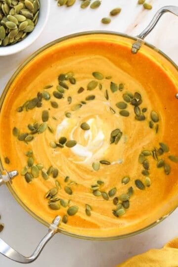 This Creamy Pumpkin Soup is the ultimate cozy fall comfort food! Made with smooth pumpkin puree, onion, garlic, warm ginger, cumin, nutmeg, flavorful broth, and rich heavy cream, this Easy Pumpkin Soup Recipe is ready in just 40 minutes. If you’re searching for Pumpkin Soup Recipes, Fall Soup Recipes, Creamy Soup Recipes, or easy Pumpkin Recipes for dinner, this simple homemade soup is a must-try. Serve this Creamy Pumpkin Soup with crusty bread, croutons, toasted pumpkin seeds, or a swirl of cream for a comforting meal. It’s perfect for chilly fall nights, Thanksgiving dinner, holiday lunches, or an easy weeknight meal. Save this Pumpkin Soup Recipe for your fall meal planning, and enjoy a warm bowl of creamy, savory pumpkin goodness all season long!