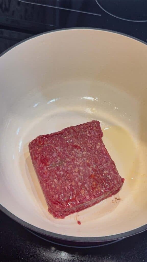 raw ground beef in a large pot
