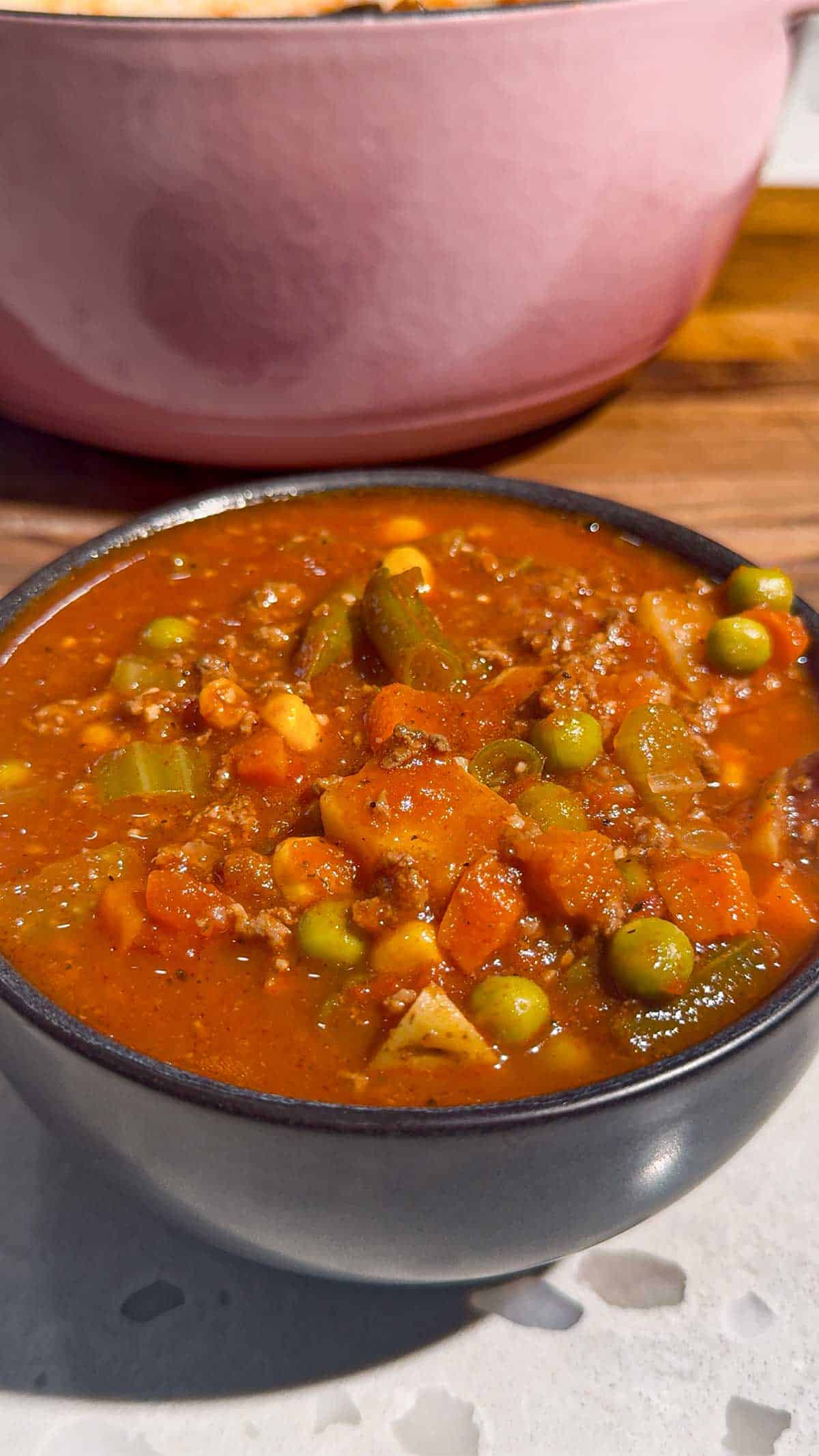 This Beef Vegetable Soup is an easy one-pot dinner loaded with seasoned ground beef, tender russet potatoes, diced tomatoes, celery, onions and colourful mixed vegetables in a rich tomato and beef broth. Ready in just 45 minutes, this hearty homemade soup is perfect for busy weeknights, chilly fall evenings and cozy winter dinners. Save this easy beef soup recipe when you need simple ground beef dinner ideas, comforting soup recipes, budget-friendly family meals or a quick way to use frozen vegetables. It’s a delicious vegetable beef soup for meal prep, freezer meals, cold-weather lunches and satisfying dinners the whole family will enjoy. Serve it with crusty bread, warm dinner rolls or crackers for an easy comfort food meal packed with meat, potatoes and vegetables.