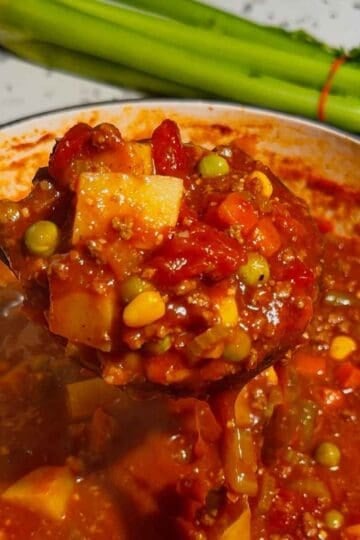 This Beef Vegetable Soup is an easy one-pot dinner loaded with seasoned ground beef, tender russet potatoes, diced tomatoes, celery, onions and colourful mixed vegetables in a rich tomato and beef broth. Ready in just 45 minutes, this hearty homemade soup is perfect for busy weeknights, chilly fall evenings and cozy winter dinners. Save this easy beef soup recipe when you need simple ground beef dinner ideas, comforting soup recipes, budget-friendly family meals or a quick way to use frozen vegetables. It’s a delicious vegetable beef soup for meal prep, freezer meals, cold-weather lunches and satisfying dinners the whole family will enjoy. Serve it with crusty bread, warm dinner rolls or crackers for an easy comfort food meal packed with meat, potatoes and vegetables.