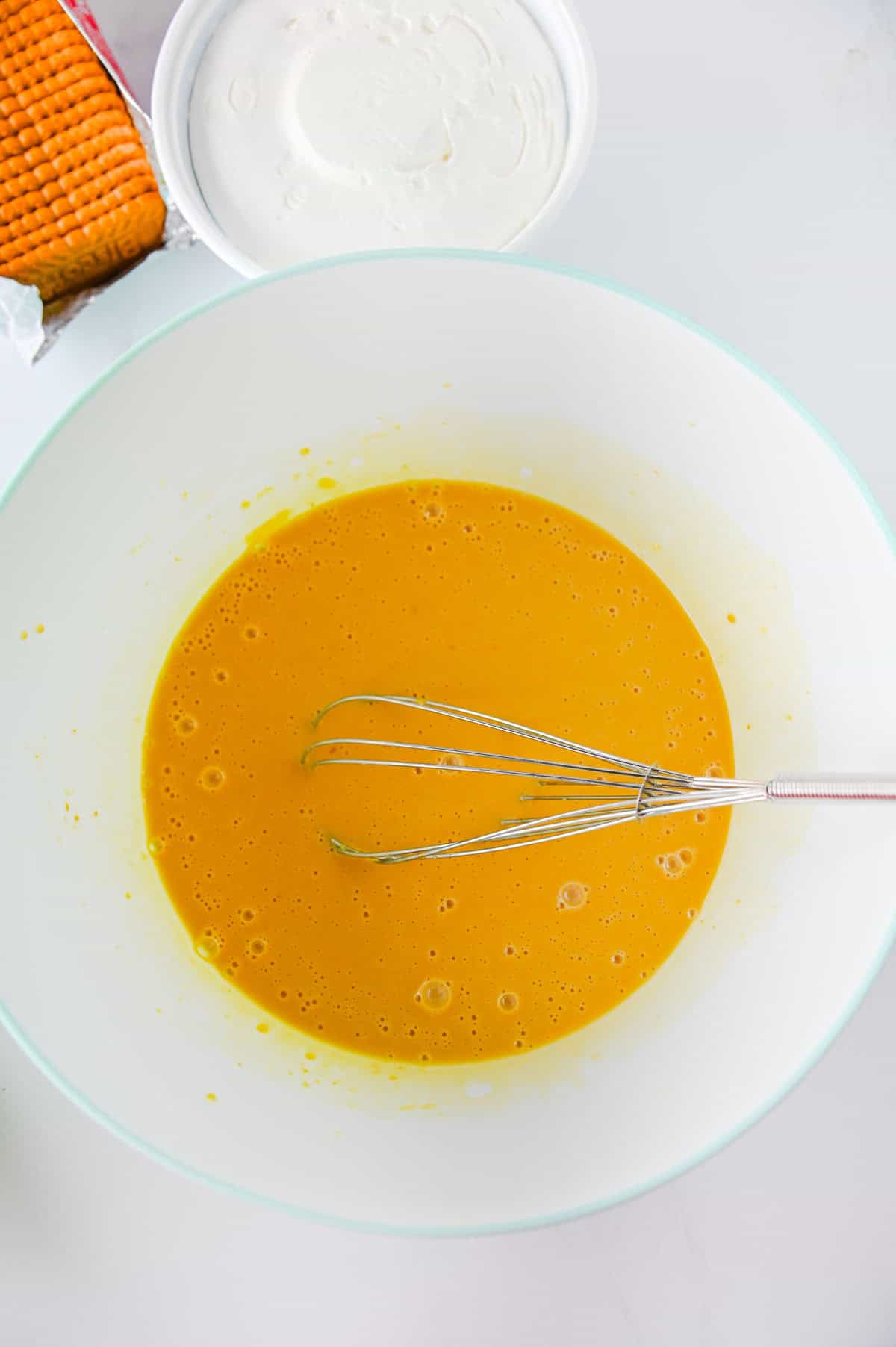 cookie butter pudding mixture in a mixing bowl