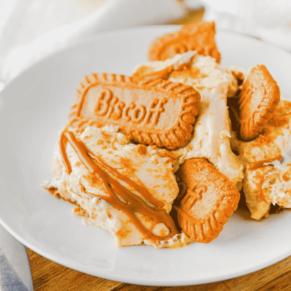 This Biscoff Banana Pudding is an easy no bake dessert layered with creamy vanilla pudding, sweet bananas, Biscoff cookies and rich cookie butter. It is perfect for potlucks, holidays, summer parties, family dinners or anytime you need a make ahead dessert that feels extra special. The pudding mixture is made with sweetened condensed milk, instant vanilla pudding, Cool Whip and melted Biscoff cookie butter for a thick, fluffy filling with caramelized cookie flavor in every bite. Layers of sliced bananas and Lotus Biscoff cookies soften in the fridge for the best banana pudding texture. Top with crushed cookies and an extra cookie butter drizzle for a simple dessert recipe everyone will ask for again. Save this Biscoff dessert for your next easy banana pudding craving.