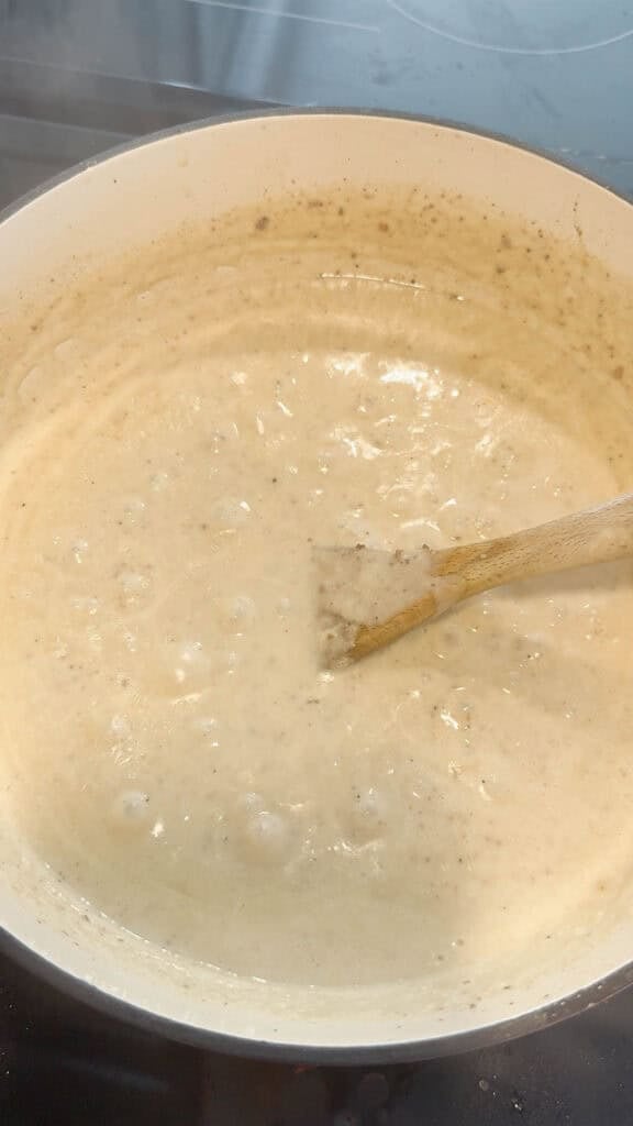 creamy hamburger soup cooking in a pot