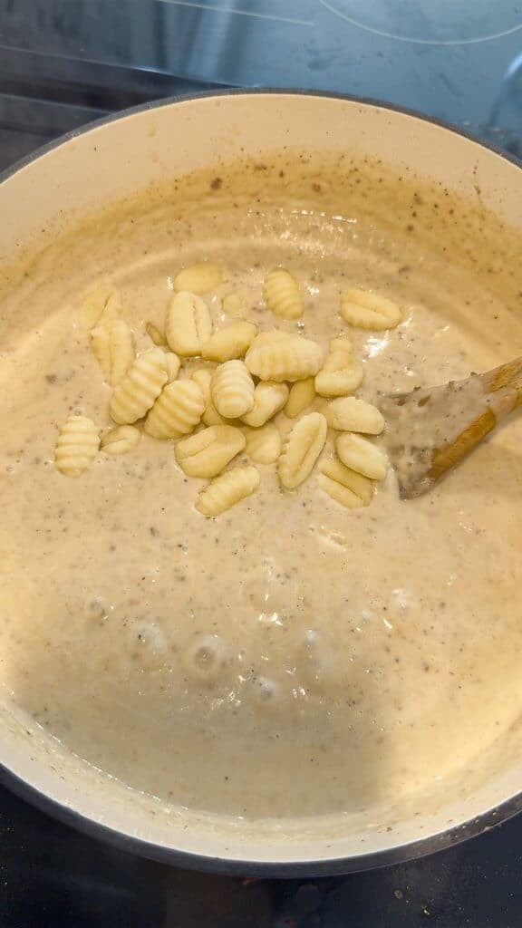 gnocchi added to pot of creamy soup