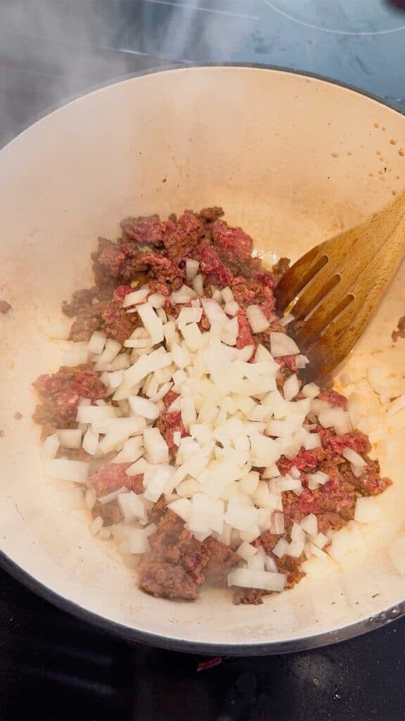 chopped onions and ground beef in a large pot