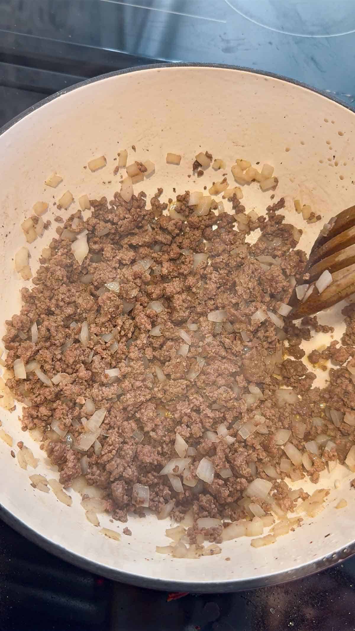 cooked ground beef in a large pot