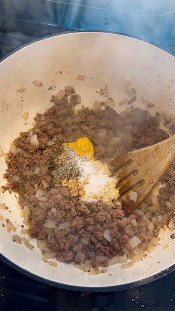 salt, pepper, mustard and chopped garlic in a large pot