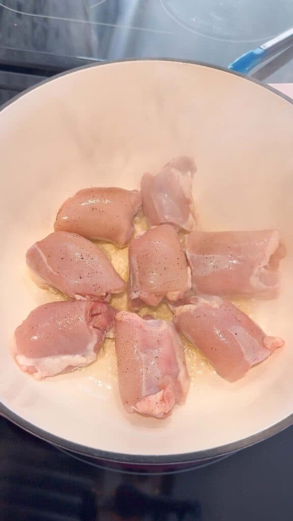 raw chicken thighs in a large pot