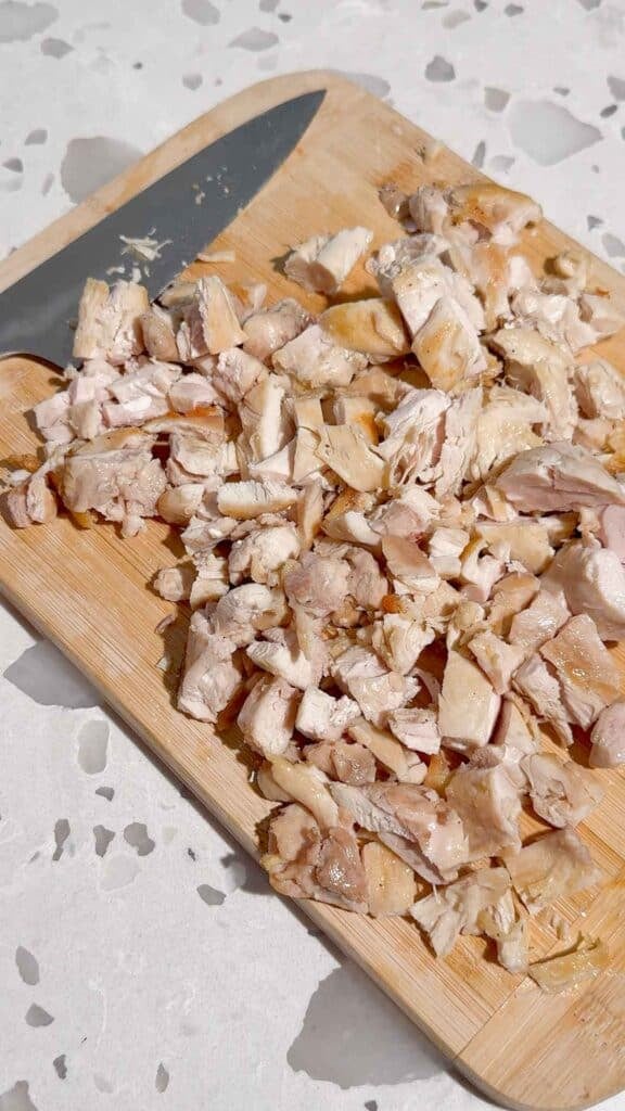 diced cooked chicken on a cutting board