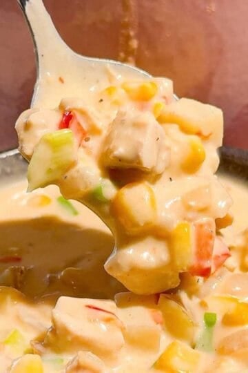 This creamy Chicken Corn Chowder is a cozy dinner for busy weeknights, chilly fall evenings and cold winter days. Tender chicken thighs, sweet corn, diced potatoes, red bell pepper and green onions are simmered in a rich, creamy broth for a hearty one pot meal the whole family will love. Save this easy chicken corn chowder recipe when you need comforting soup recipes, creamy chicken soup, corn chowder with potatoes, chicken thigh recipes or quick family dinner ideas. This homemade corn chowder is ready in just 45 minutes and pairs perfectly with crusty bread, biscuits or a simple salad. It’s an easy soup recipe for meal prep, Sunday dinner, weeknight meals or feeding a hungry crowd. Make this thick and creamy chicken and corn soup whenever you’re craving warm, satisfying comfort food!