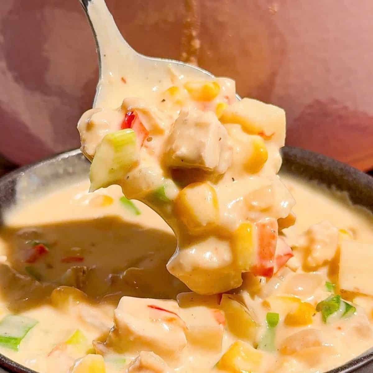 This creamy Chicken Corn Chowder is a cozy dinner for busy weeknights, chilly fall evenings and cold winter days. Tender chicken thighs, sweet corn, diced potatoes, red bell pepper and green onions are simmered in a rich, creamy broth for a hearty one pot meal the whole family will love. Save this easy chicken corn chowder recipe when you need comforting soup recipes, creamy chicken soup, corn chowder with potatoes, chicken thigh recipes or quick family dinner ideas. This homemade corn chowder is ready in just 45 minutes and pairs perfectly with crusty bread, biscuits or a simple salad. It’s an easy soup recipe for meal prep, Sunday dinner, weeknight meals or feeding a hungry crowd. Make this thick and creamy chicken and corn soup whenever you’re craving warm, satisfying comfort food!