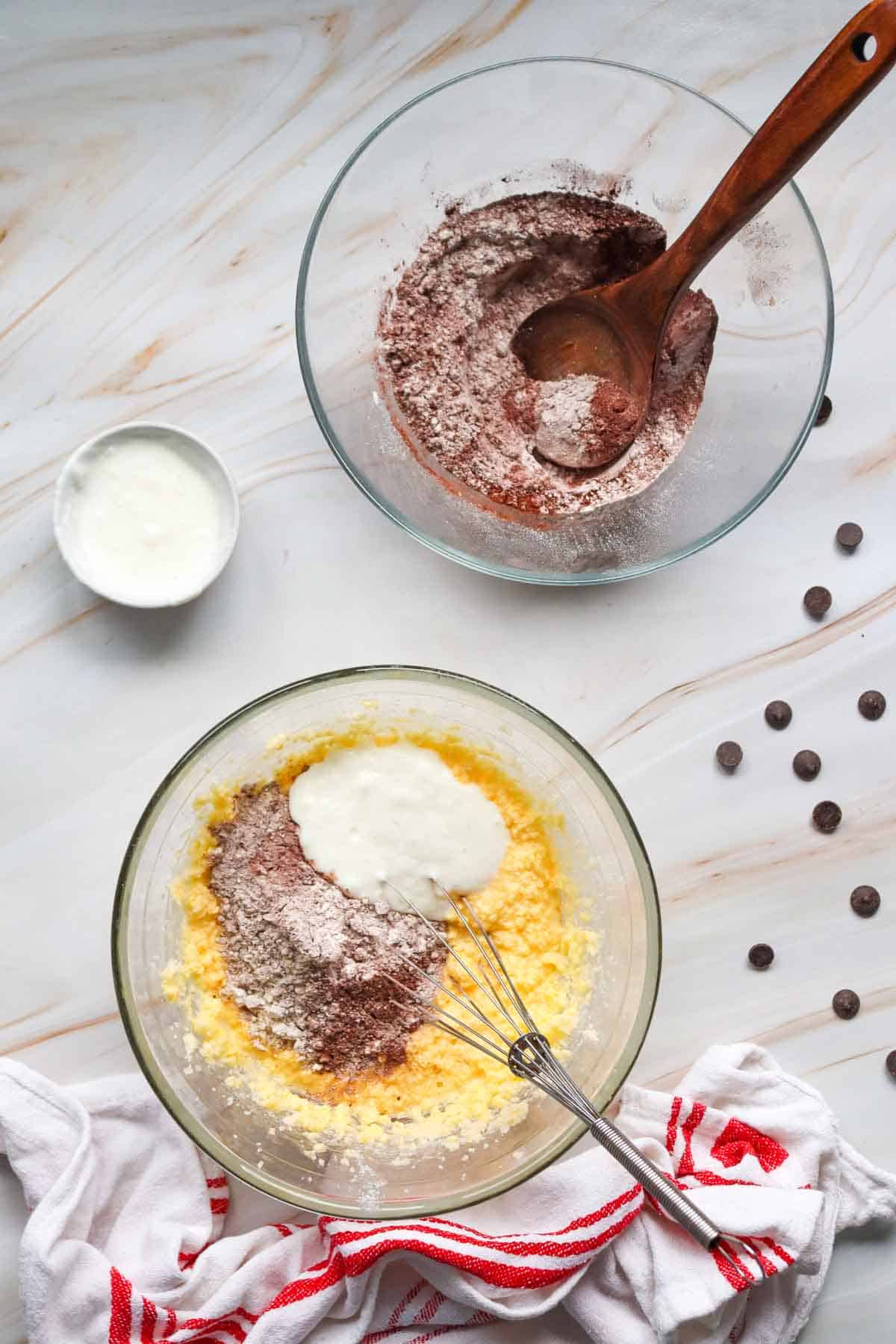 adding dry ingredients to bowl with butter and sugar mixture