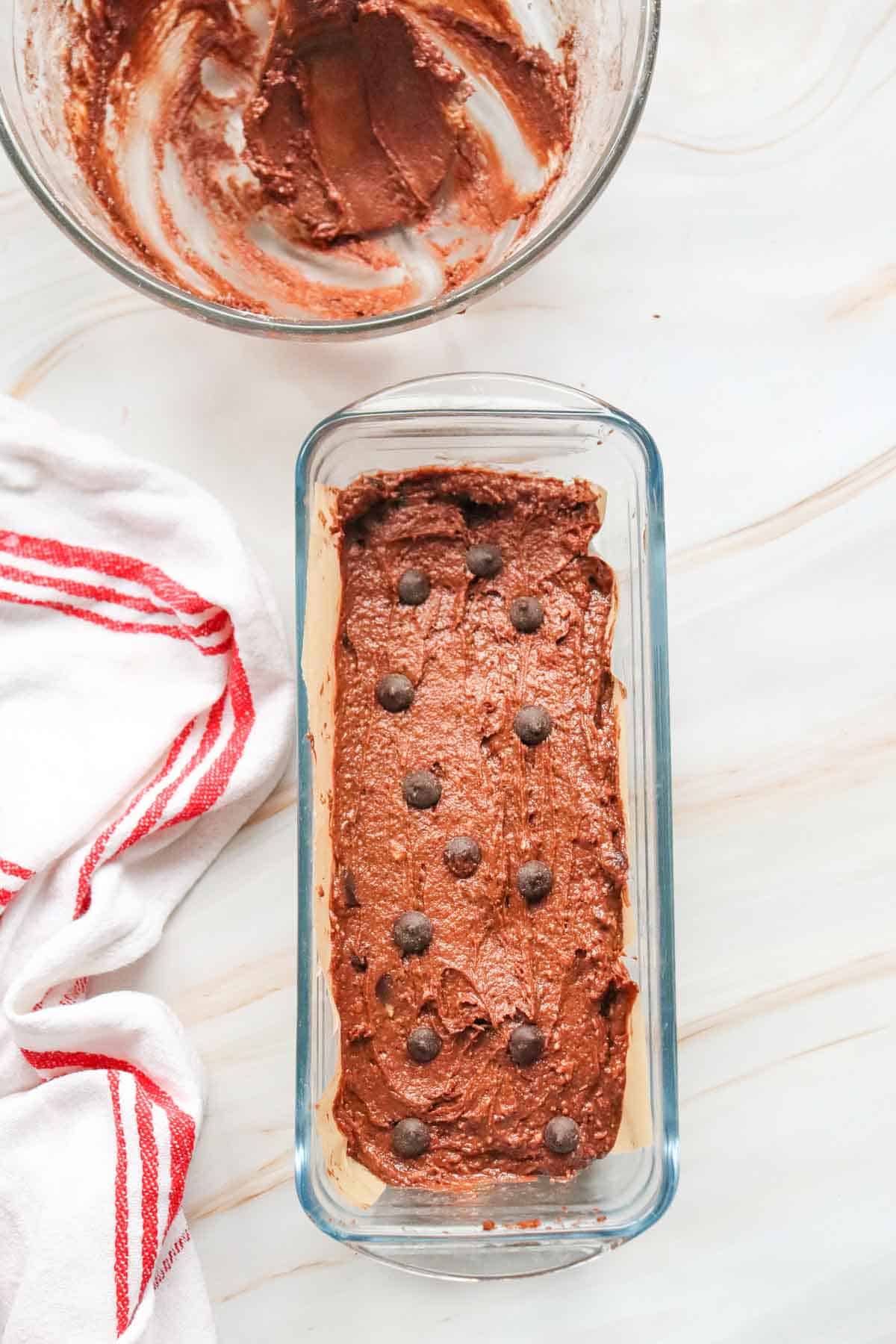 chocolate loaf cake batter in a loaf pan