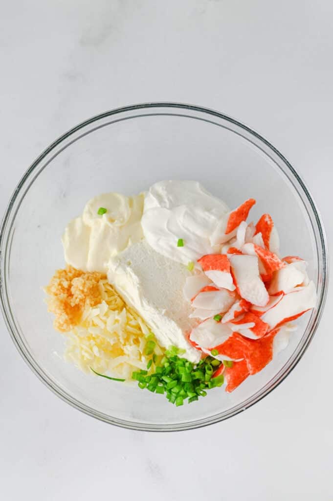 crab rangoon dip ingredients in a mixing bowl